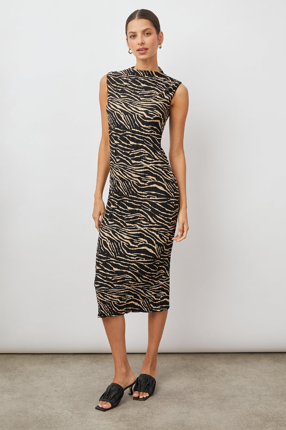 Wakely Sleeveless Midi Dress with Pleated Fabric and a Mock Neck in Cairo Colorway, a Black and Tan Tiger Print - Front Full Body View Featured on Model 
