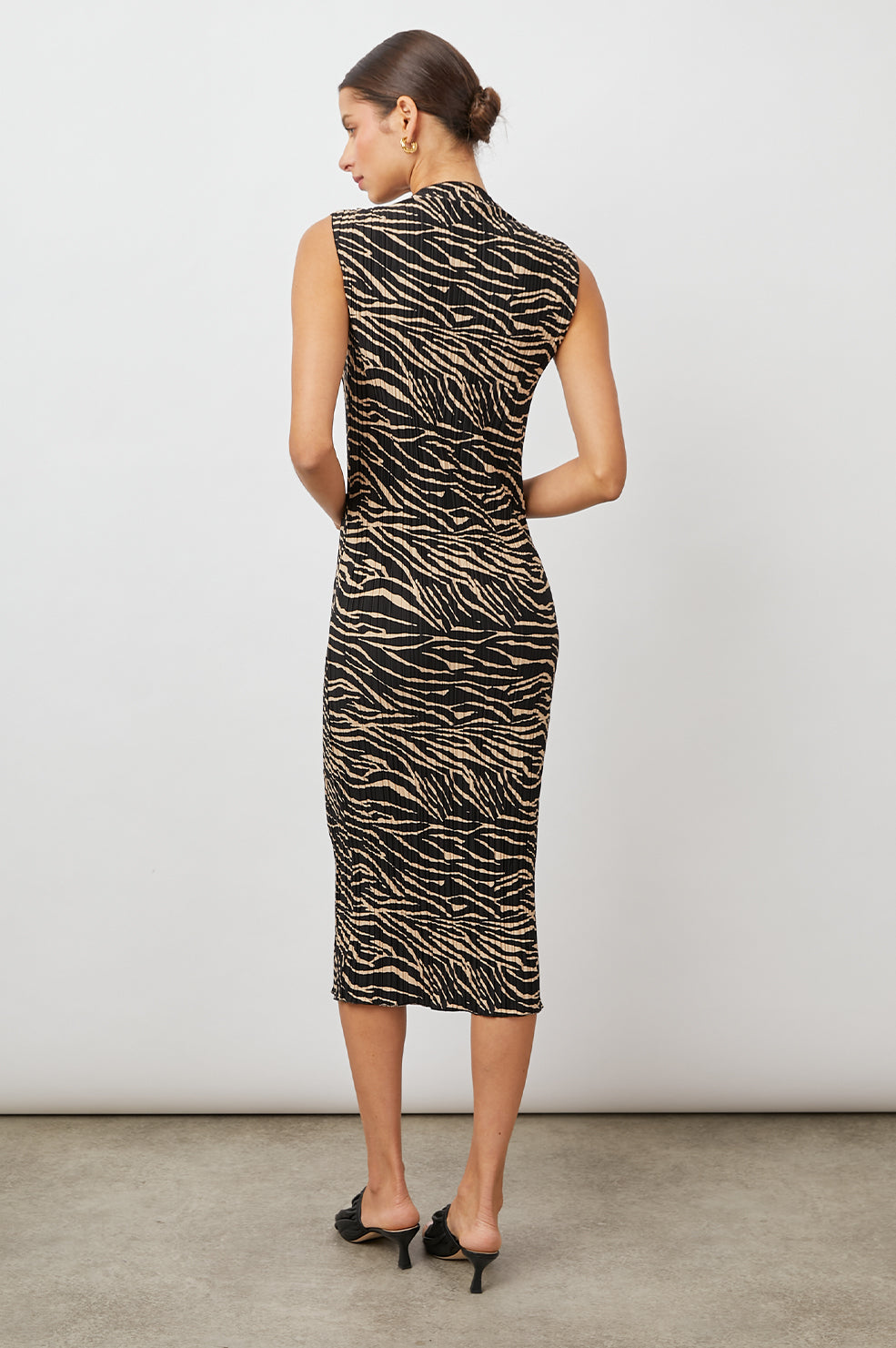 Wakely Sleeveless Midi Dress with Pleated Fabric and a Mock Neck in Cairo Colorway, a Black and Tan Tiger Print - Back Full Body View Featured on Model 