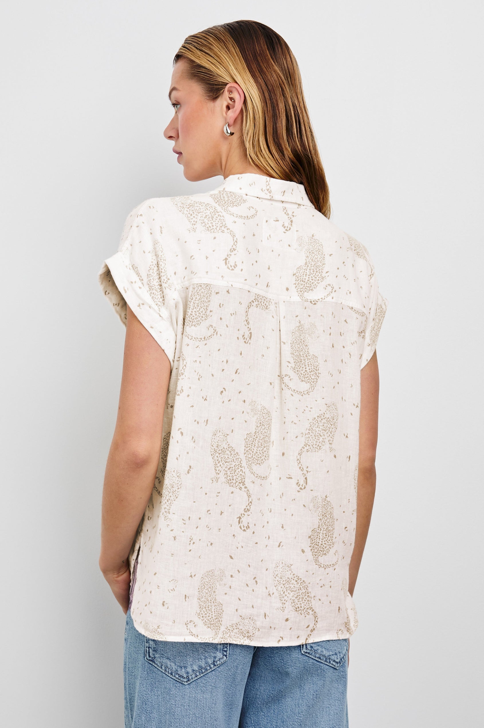 Whitney Short Rolled Sleeves Button Up with a Chest Patch Pocket and Short Side Slits in Cheetah Spots Colorway, with spots and cheetahs in brown on cream - Back View Featured on Model