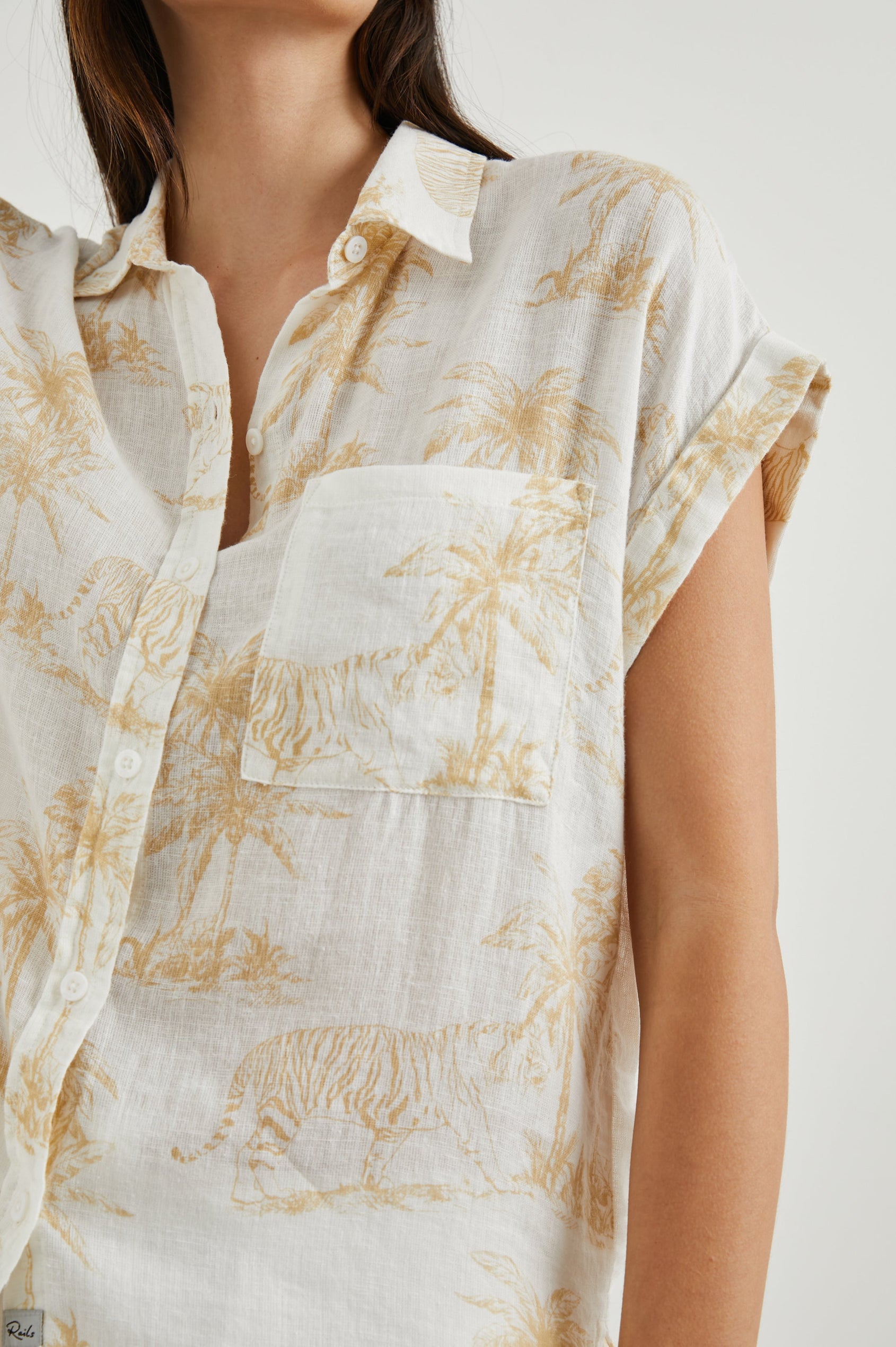 Whitney Short Rolled Sleeves Button Up with a Chest Patch Pocket and Short Side Slits in Wild Bengals Colorway, with brown bengals and trees on cream - Front View Featured on Model