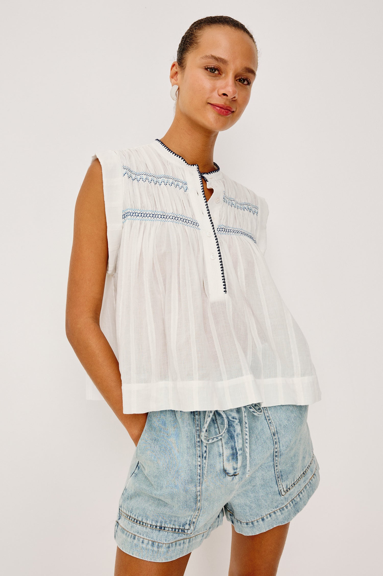 Willow Sleeveless Top in Cotton Voile With Diamond Pintucks at Front and Back Yokes, Rolled Arm Openings, Center Half Placket, and Loose Fit in White Colorway - Upper Body Front View Featured on Model