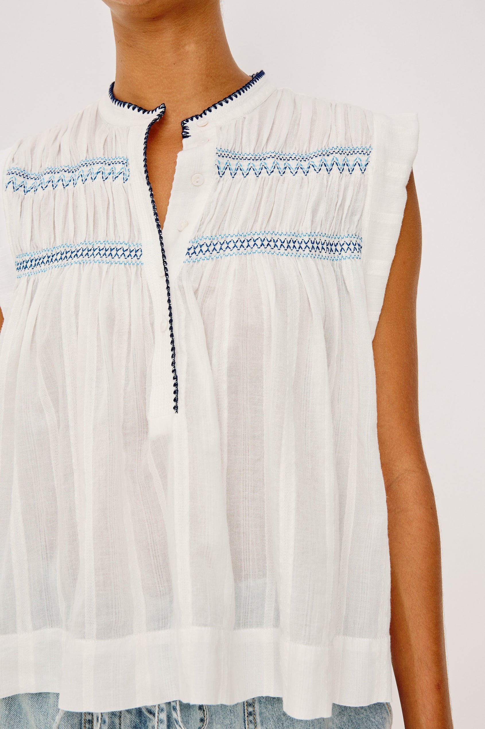 Willow Sleeveless Top in Cotton Voile With Diamond Pintucks at Front and Back Yokes, Rolled Arm Openings, Center Half Placket, and Loose Fit in White Colorway - Upper Body Front View Featured on Model