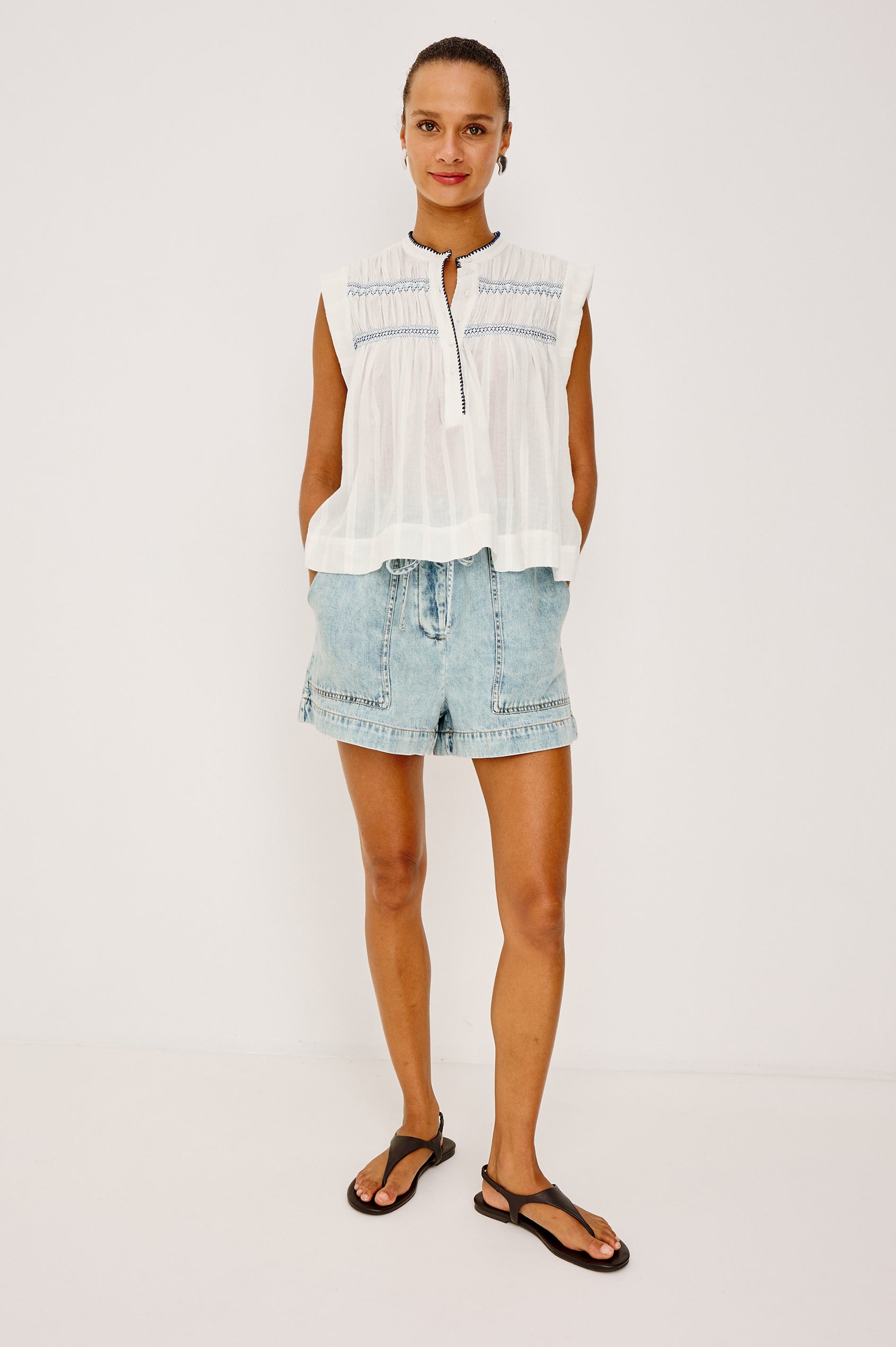 Willow Sleeveless Top in Cotton Voile With Diamond Pintucks at Front and Back Yokes, Rolled Arm Openings, Center Half Placket, and Loose Fit in White Colorway - Full Body Front View Featured on Model