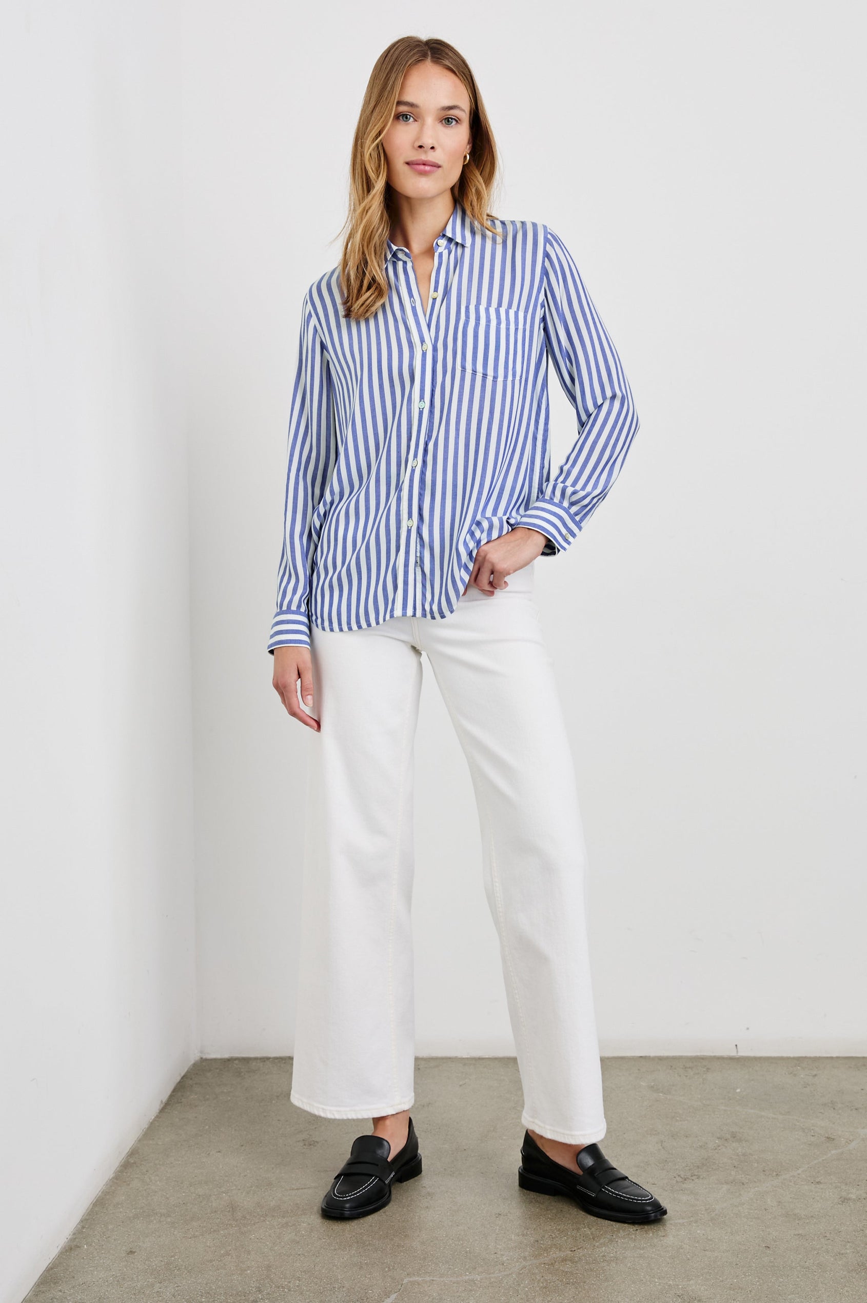 Wren Long-Sleeve Button Up with Chest Patch Pocket in Blue White Colorway, vertical stripes - Front Tucked Full Body View Featured on Model
