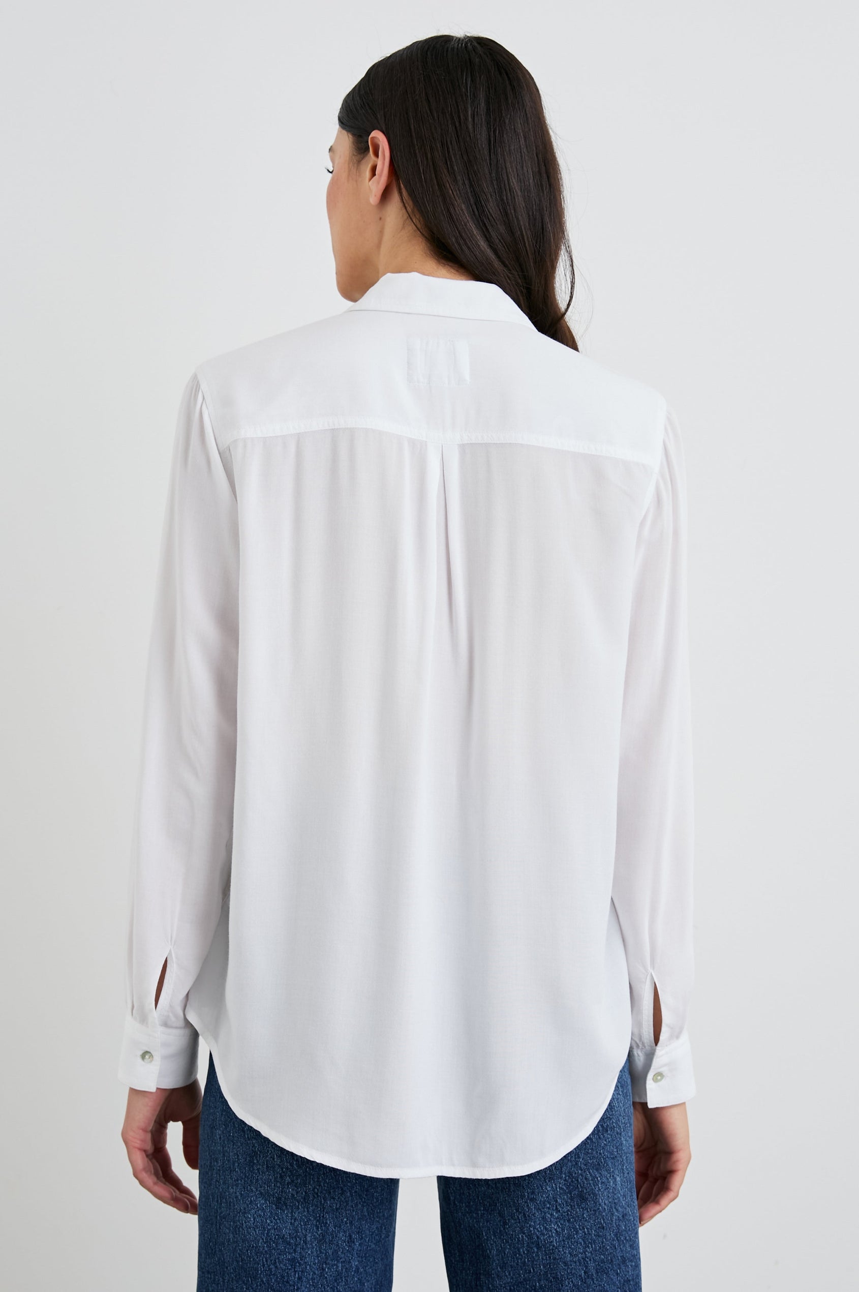Wren Long-Sleeve Button Up with Chest Patch Pocket in White Colorway - Back View Featured on Model