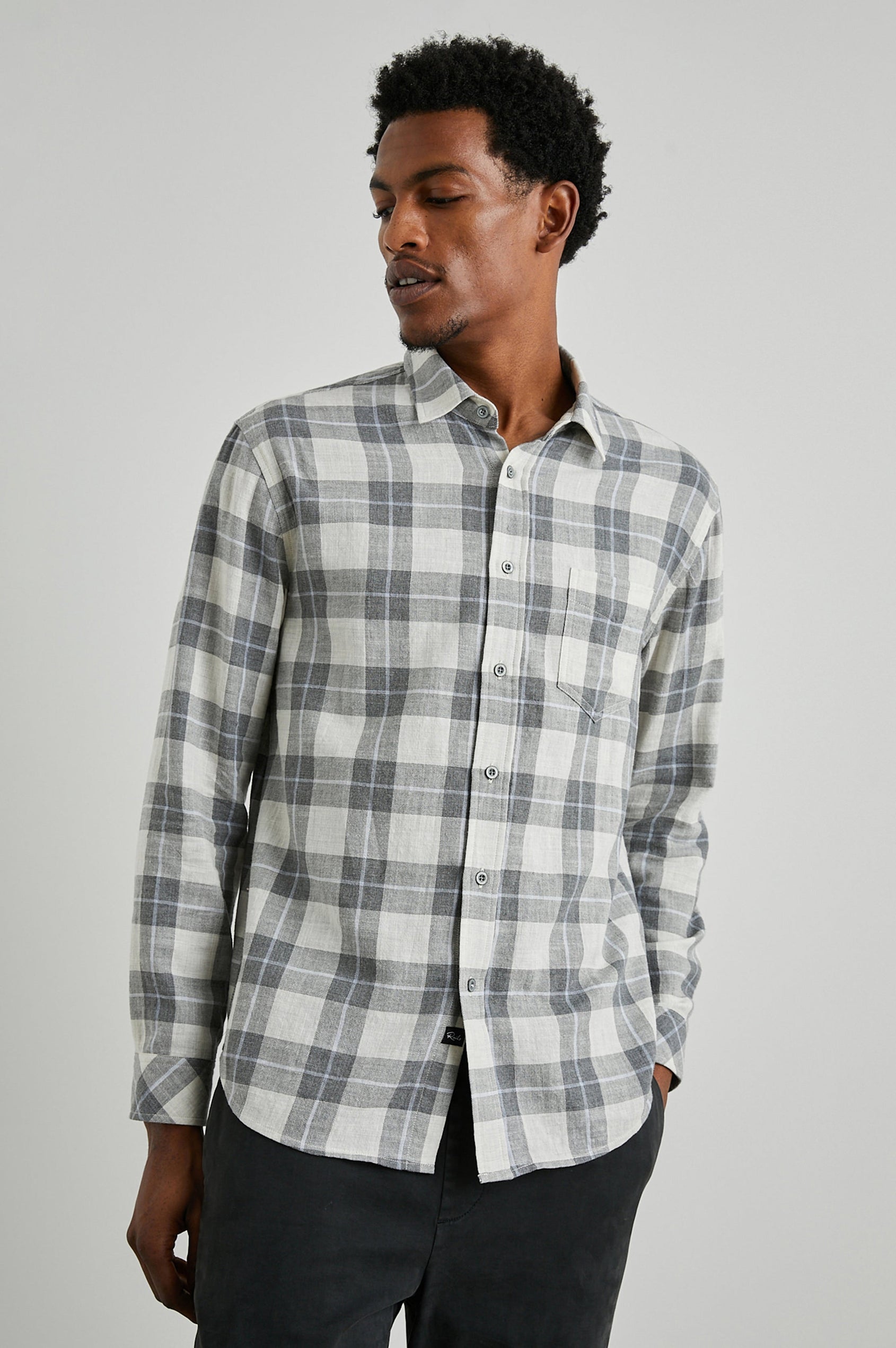 Wyatt Long-Sleeve Button Up with a Chest Patch Pocket in Anthrocite Sky Melange Colorway, a plaid with Anthrocite, Sky and Cream - Front View Featured on Model