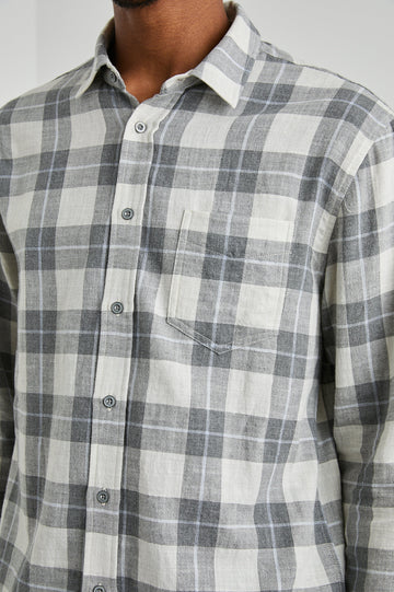 Wyatt Long-Sleeve Button Up with a Chest Patch Pocket in Anthrocite Sky Melange Colorway, a plaid with Anthrocite, Sky and Cream - Front View Featured on Model