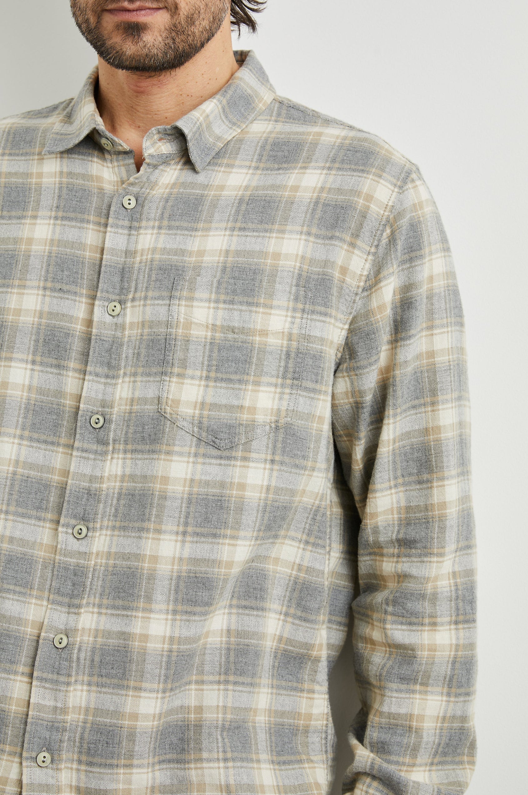 Wyatt Long-Sleeve Button Up with a Chest Patch Pocket in Charcoal Desert Melange Colorway, a charcoal, desert and cream plaid - Front View Featured on Model