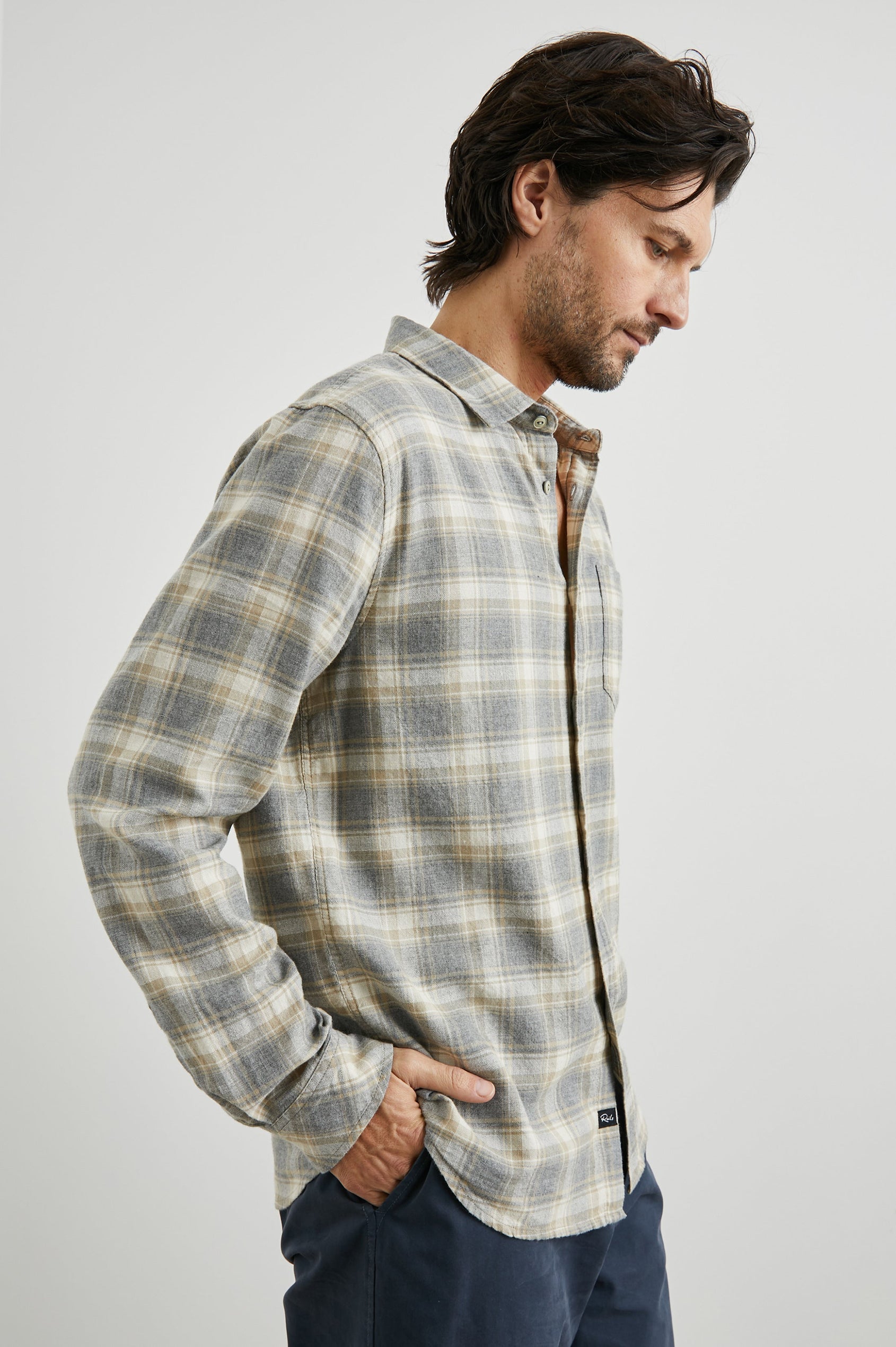 Wyatt Long-Sleeve Button Up with a Chest Patch Pocket in Charcoal Desert Melange Colorway, a charcoal, desert and cream plaid - Side View Featured on Model