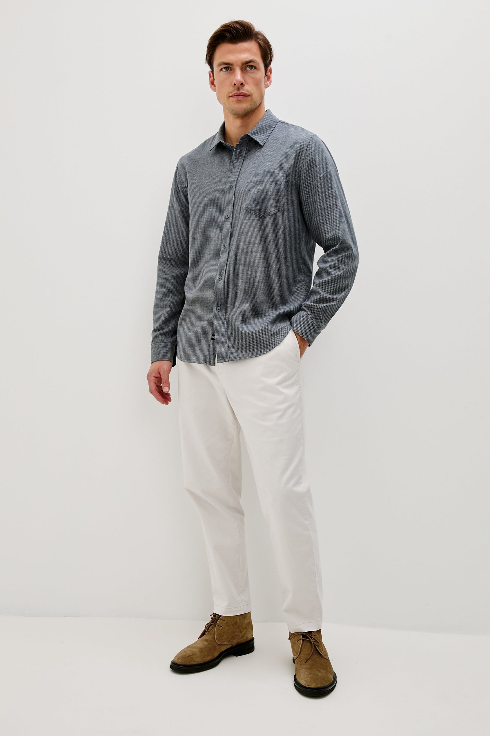 Wyatt Collared Button Front Shirt with Long Sleeves and a Chest Pocket in Charcoal Navy Houndstooth Colorway. Front Full Body View Shown on Model.