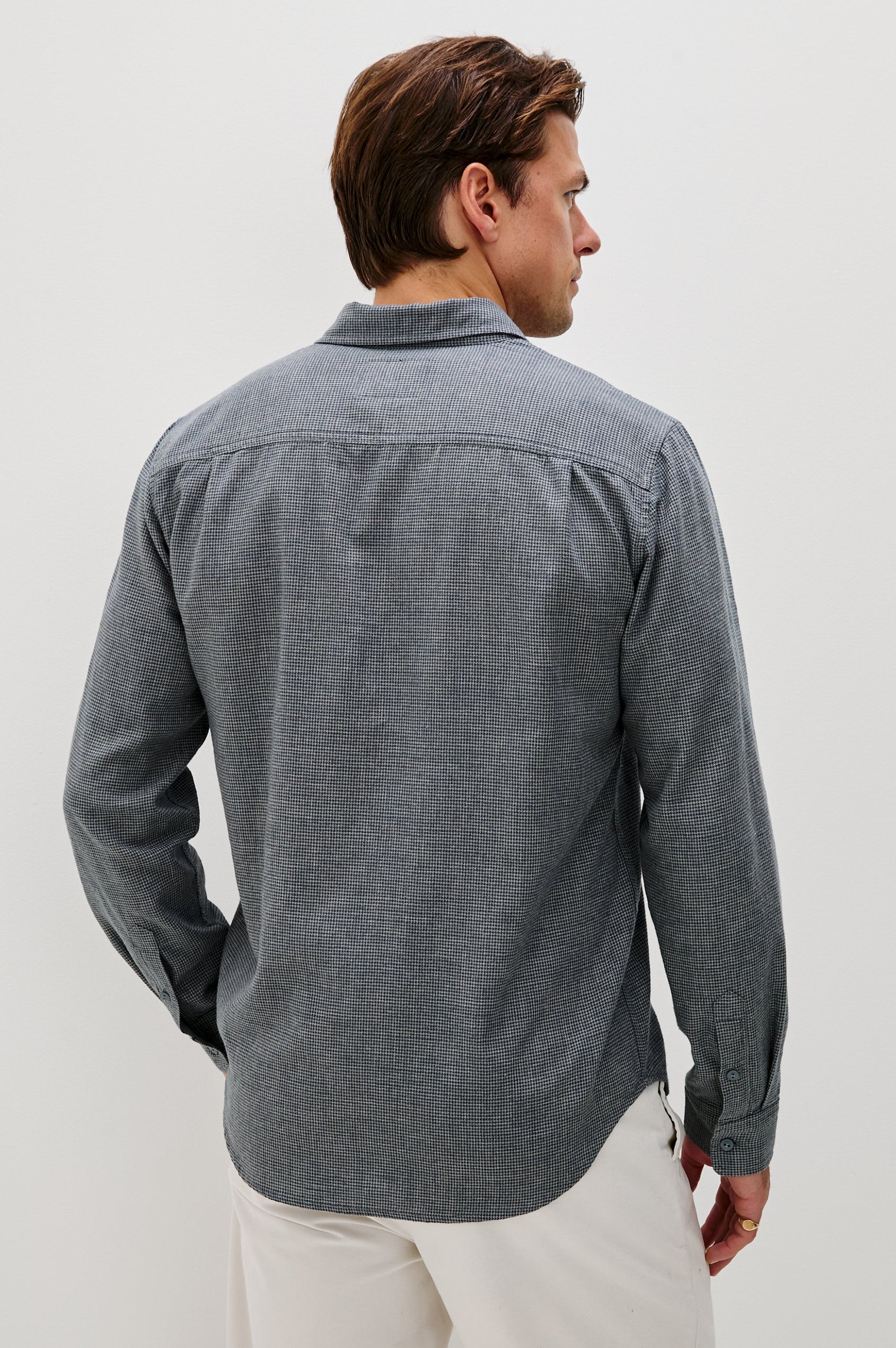 Wyatt Collared Button Front Shirt with Long Sleeves and a Chest Pocket in Charcoal Navy Houndstooth Colorway. Back View Shown on Model.