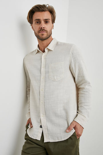 Wyatt Long-Sleeve Button Up with a Chest Patch Pocket in Hummus Colorway - Front View Featured on Model