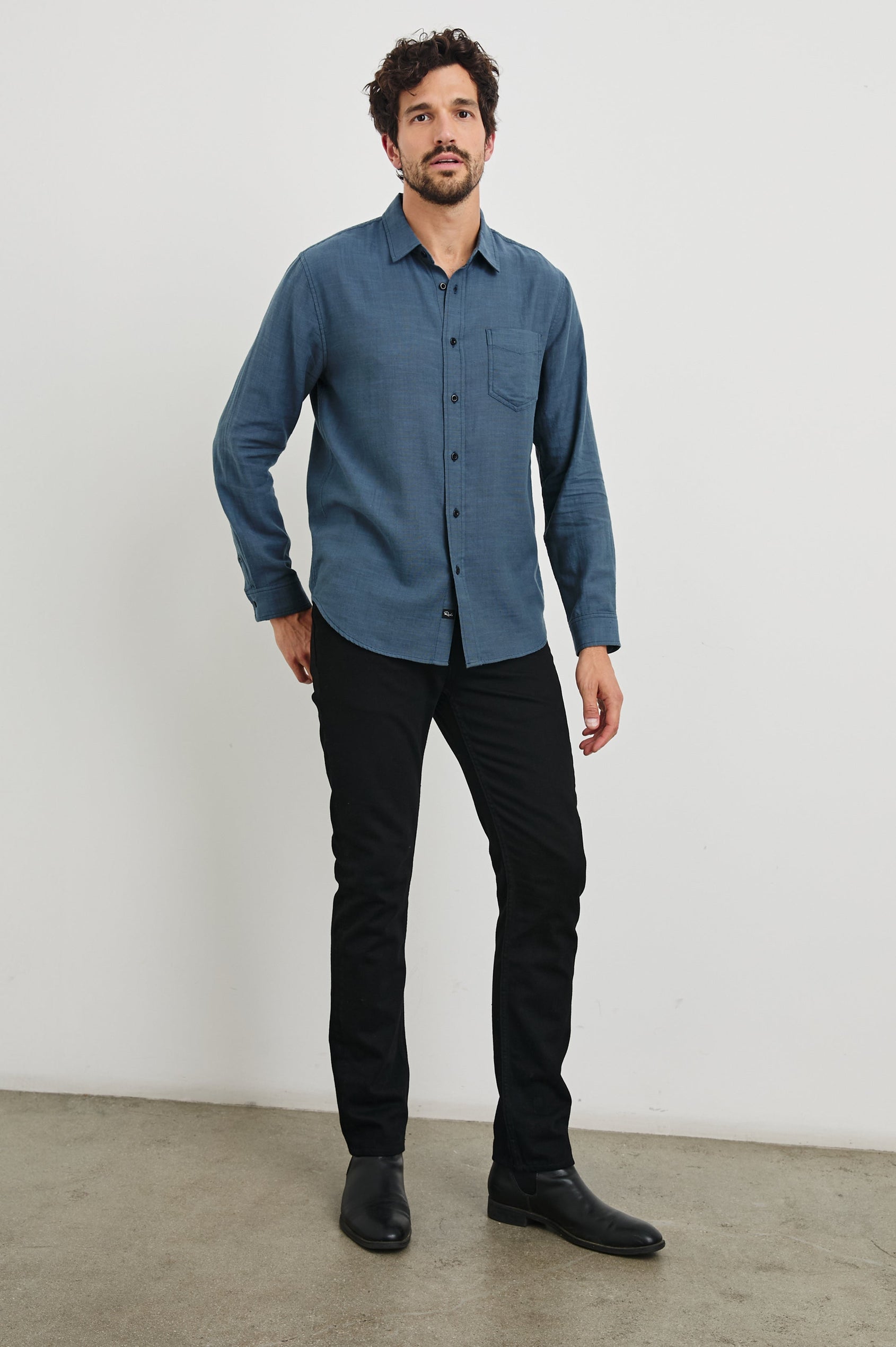 Wyatt Long-Sleeve Button Up with a Chest Patch Pocket in Sea Blue Colorway - Front Full Body View Featured on Model
