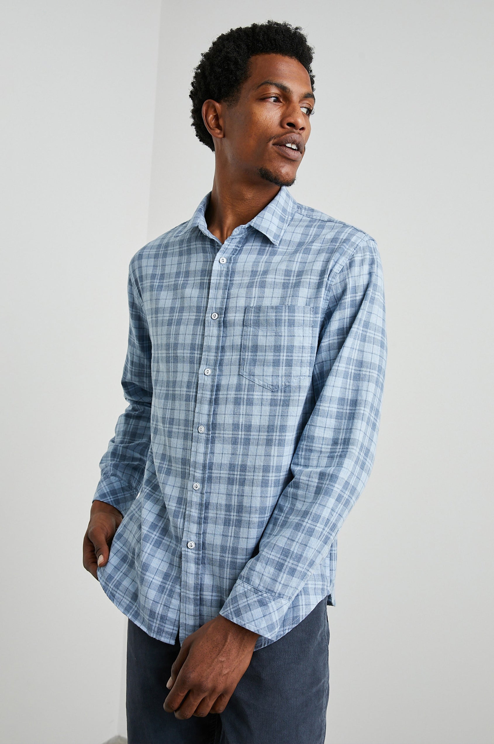 Wyatt Long-Sleeve Button Up with a Chest Patch Pocket in Sky Demin Heather Colorway, a plaid - Front View Featured on Model