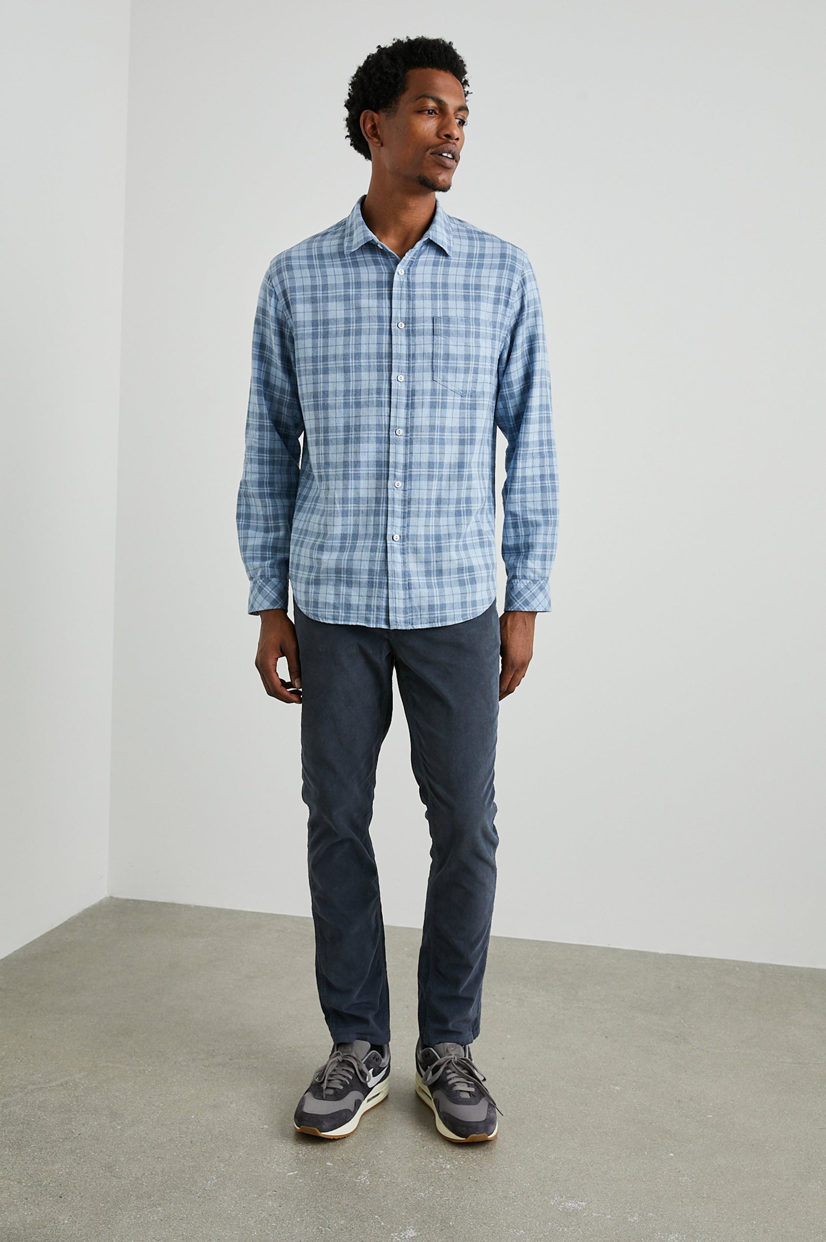 Wyatt Long-Sleeve Button Up with a Chest Patch Pocket in Sky Demin Heather Colorway, a plaid - Front Full Body View Featured on Model