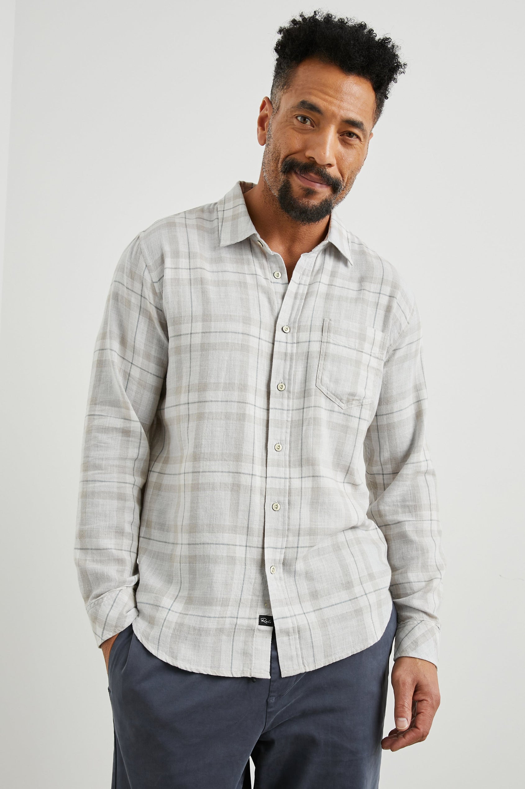 Wyatt Long-Sleeve Button Up with a Chest Patch Pocket in Tapir Agave Melange Colorway, a Tapir, Agave and cream plaid - Front View Featured on Model