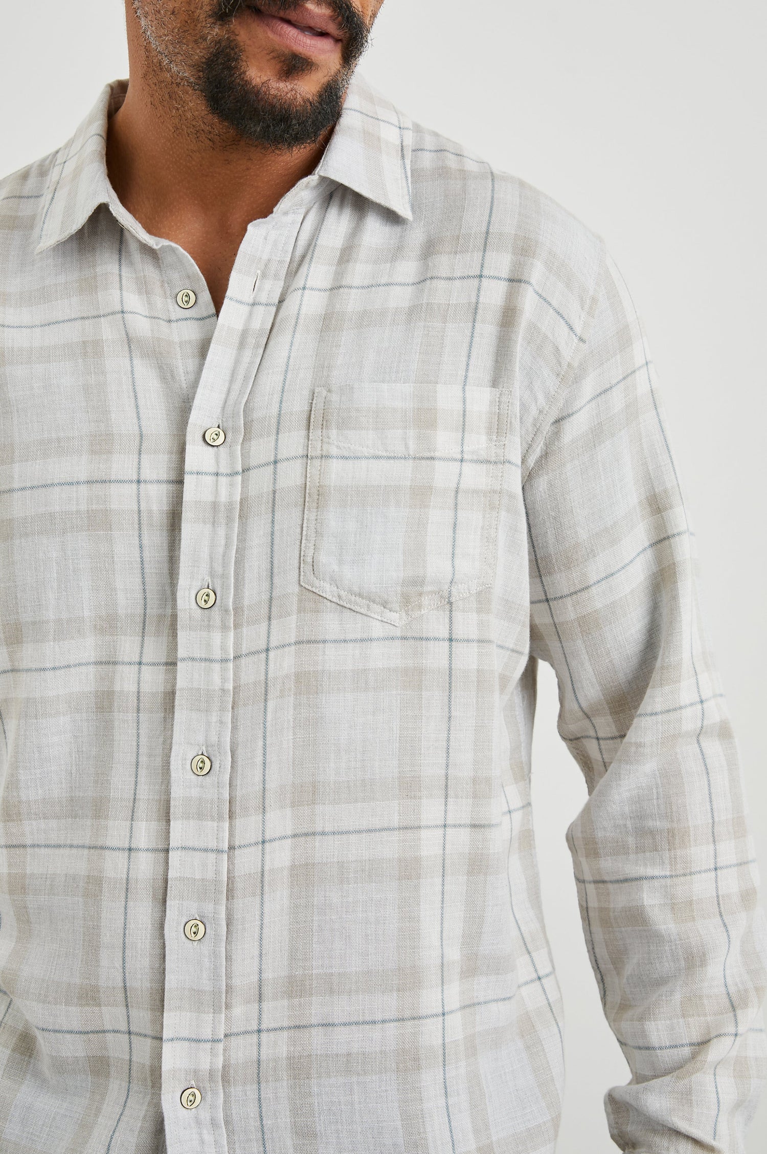 Wyatt Long-Sleeve Button Up with a Chest Patch Pocket in Tapir Agave Melange Colorway, a Tapir, Agave and cream plaid - Front View Featured on Model