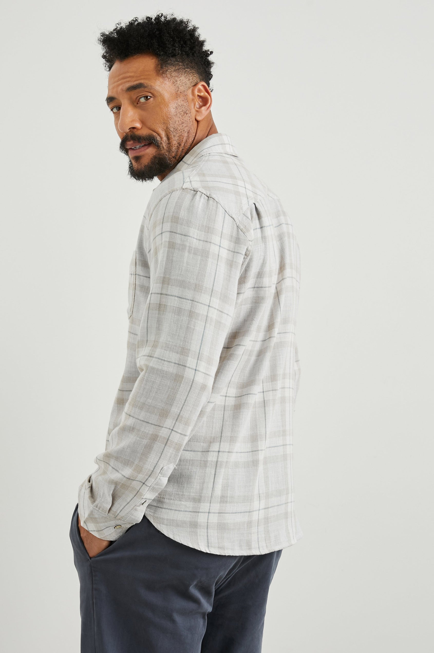 Wyatt Long-Sleeve Button Up with a Chest Patch Pocket in Tapir Agave Melange Colorway, a Tapir, Agave and cream plaid - Side View Featured on Model