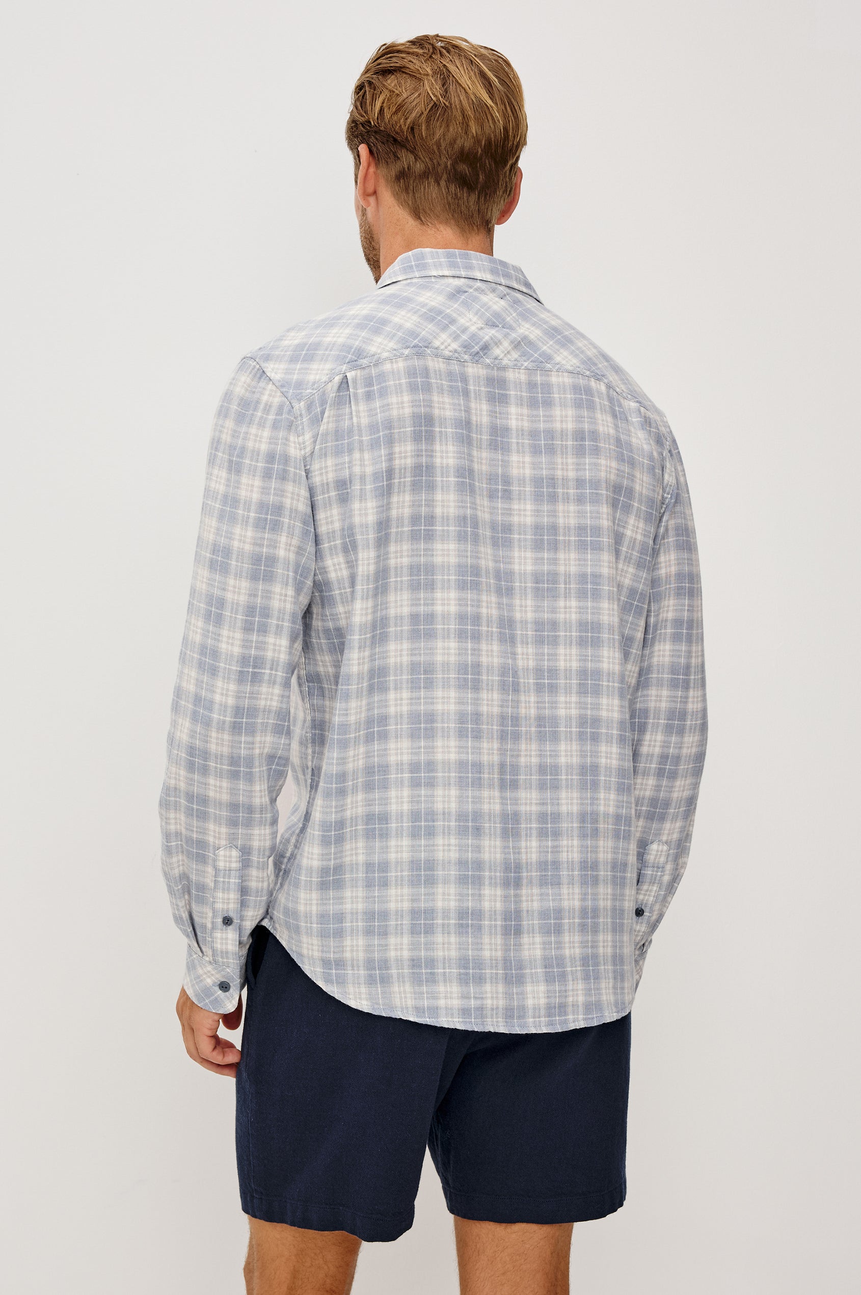 Wyatt Button Front Shirt in Soft Cotton Slub With Collar, Chest Patch Pocket, Long Sleeves, and Relaxed Fit in Cloud Cream Colorway - Upper Body Back View Featured on Model