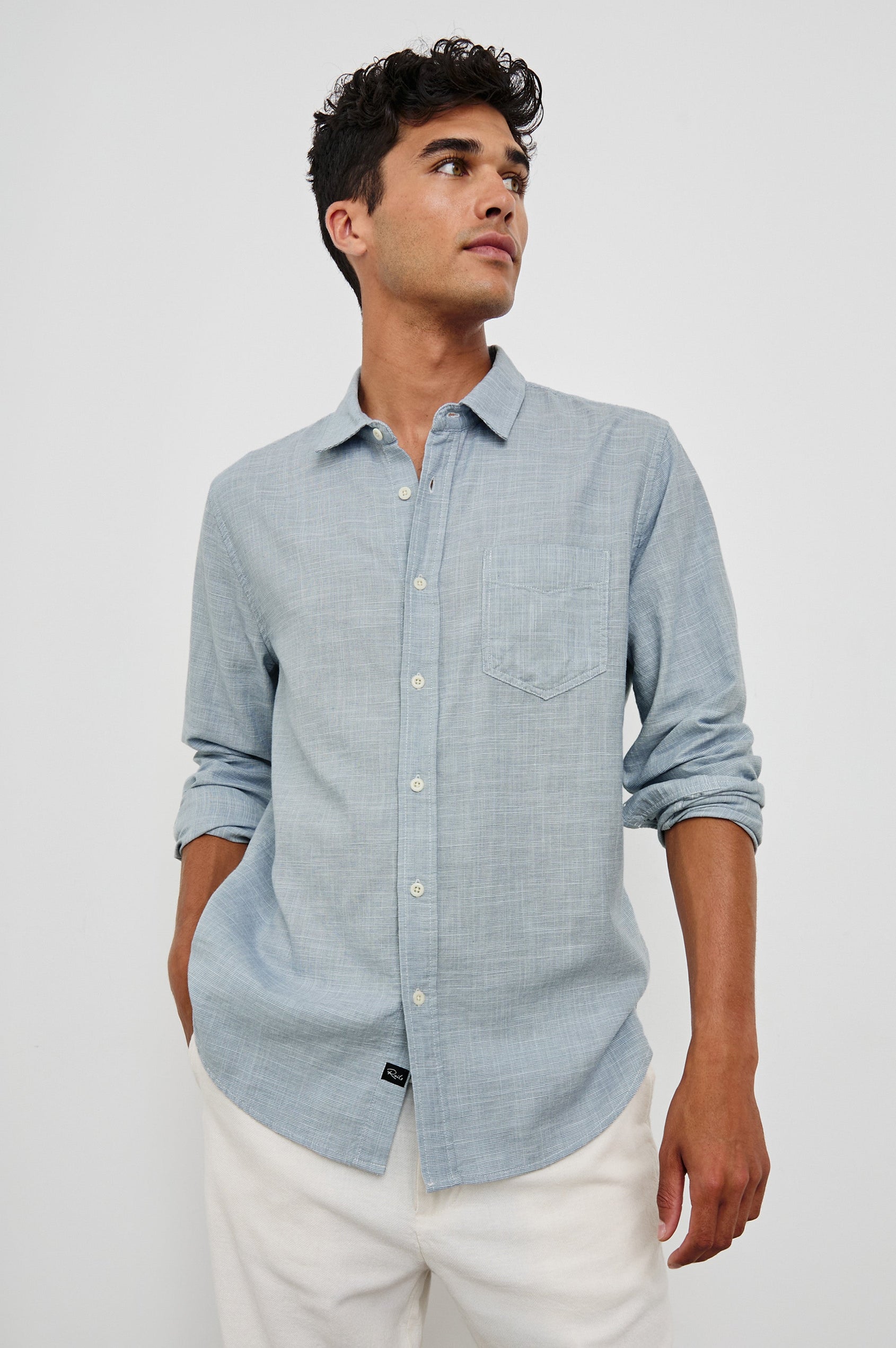 Wyatt Classic Button Up Long Sleeve Shirt in light blue Tidal Etch - front view on model, hand in pocket