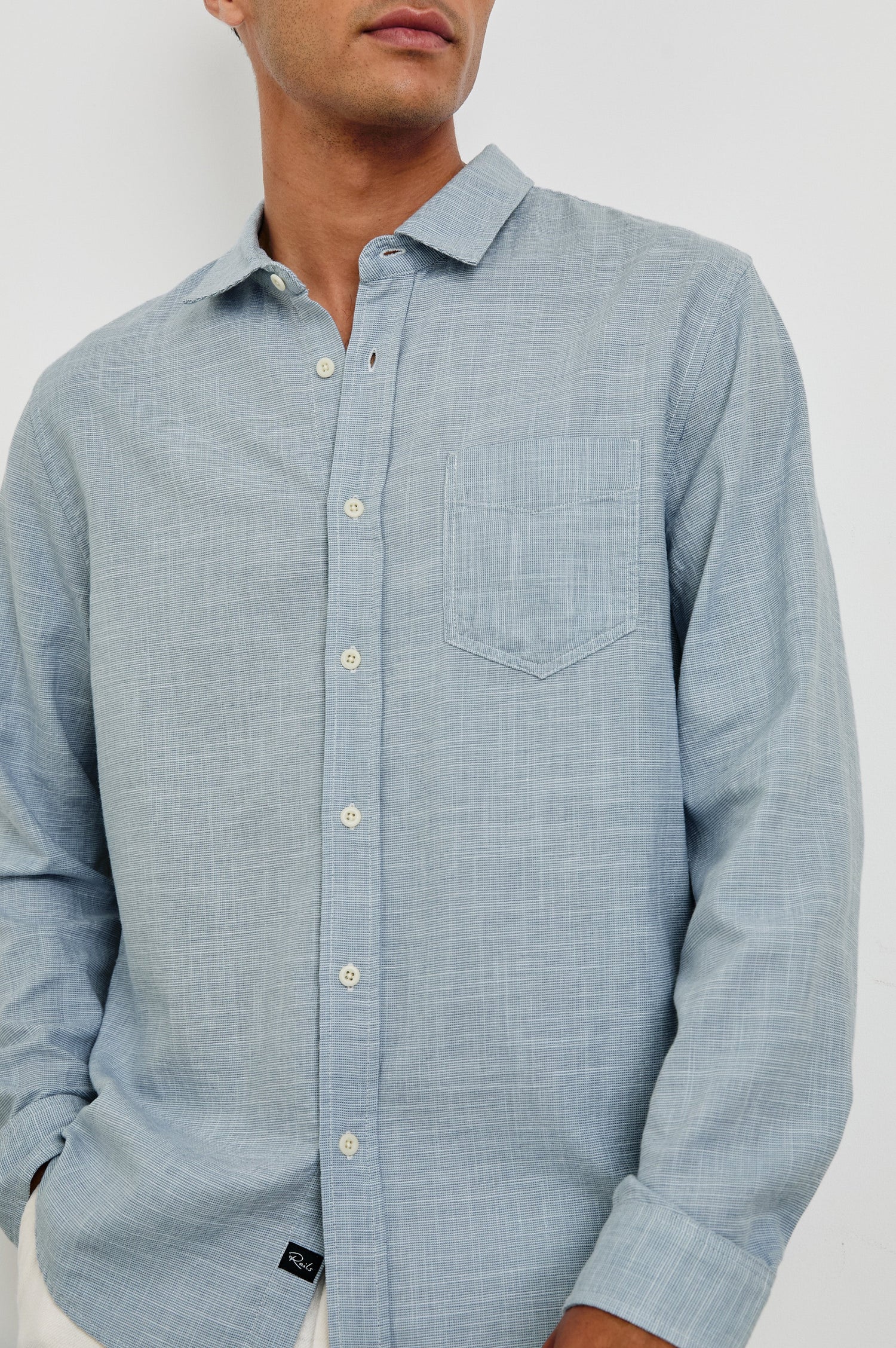 Wyatt Classic Button Up Long Sleeve Shirt in light blue Tidal Etch - close up view on model