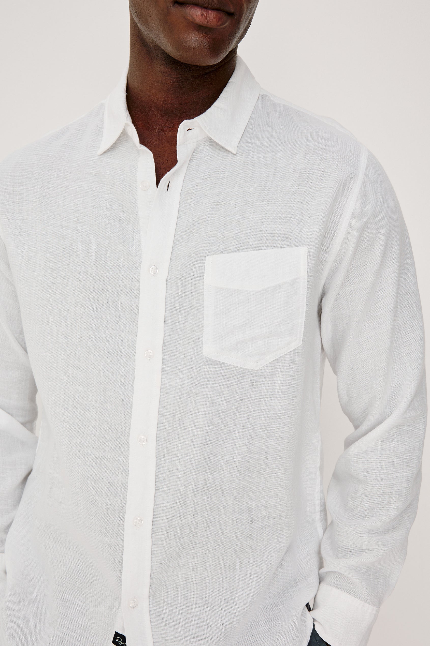 Wyatt Button Front Collared Shirt With Long Sleeves and Single Chest Pocket in White Colorway - Upper Body Front Close Up View Featured on Model