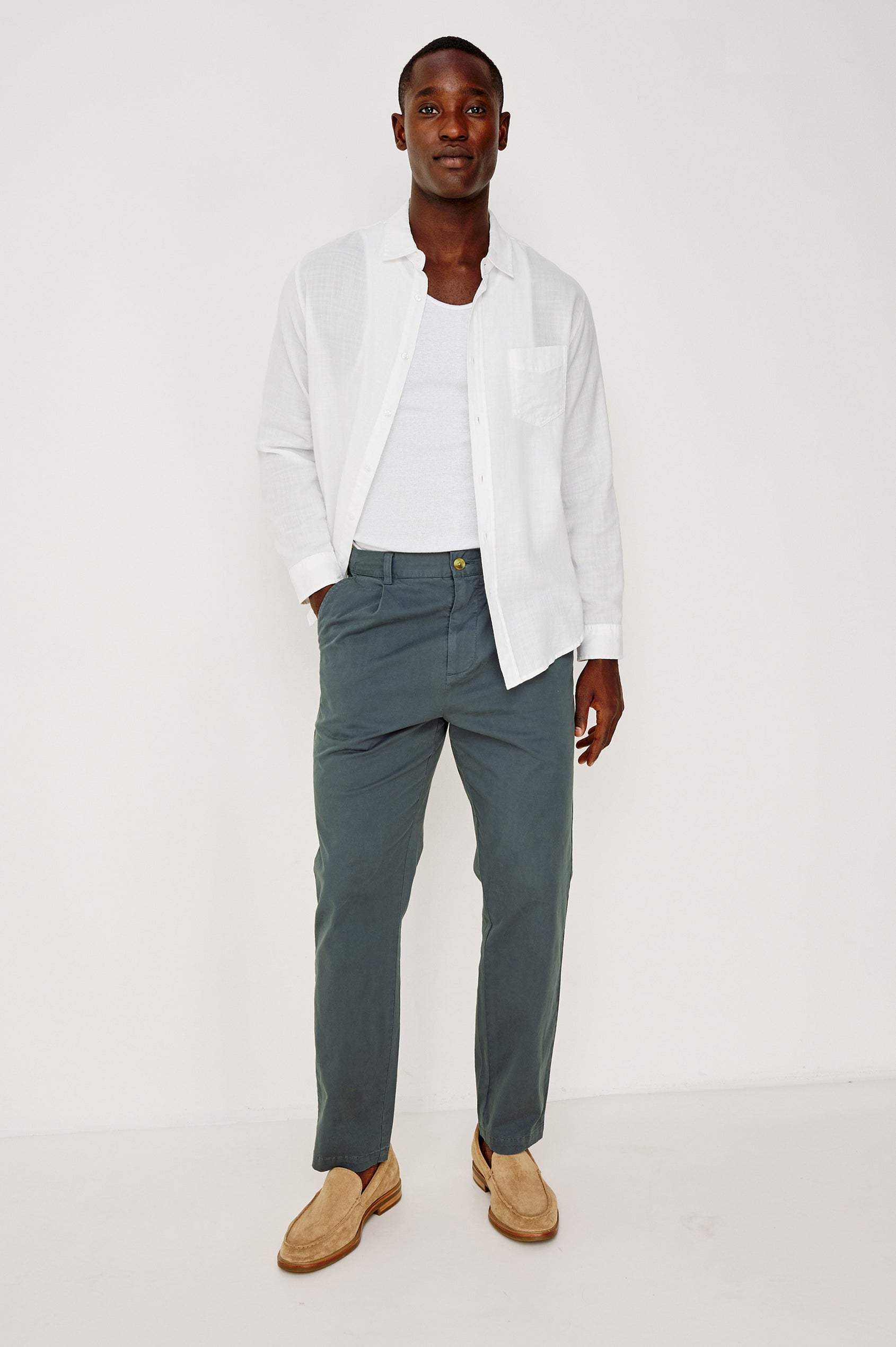 Wyatt Button Front Collared Shirt With Long Sleeves and Single Chest Pocket in White Colorway - Full Body Front View Featured on Model