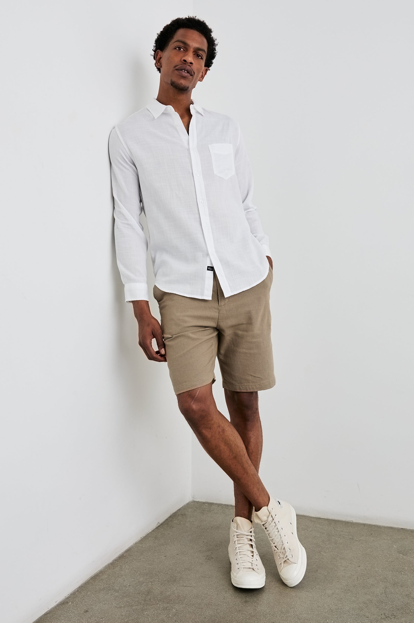 Wyatt Classic Button Up Long Sleeve Shirt with collar and front chest pocket in White - full body front view on model