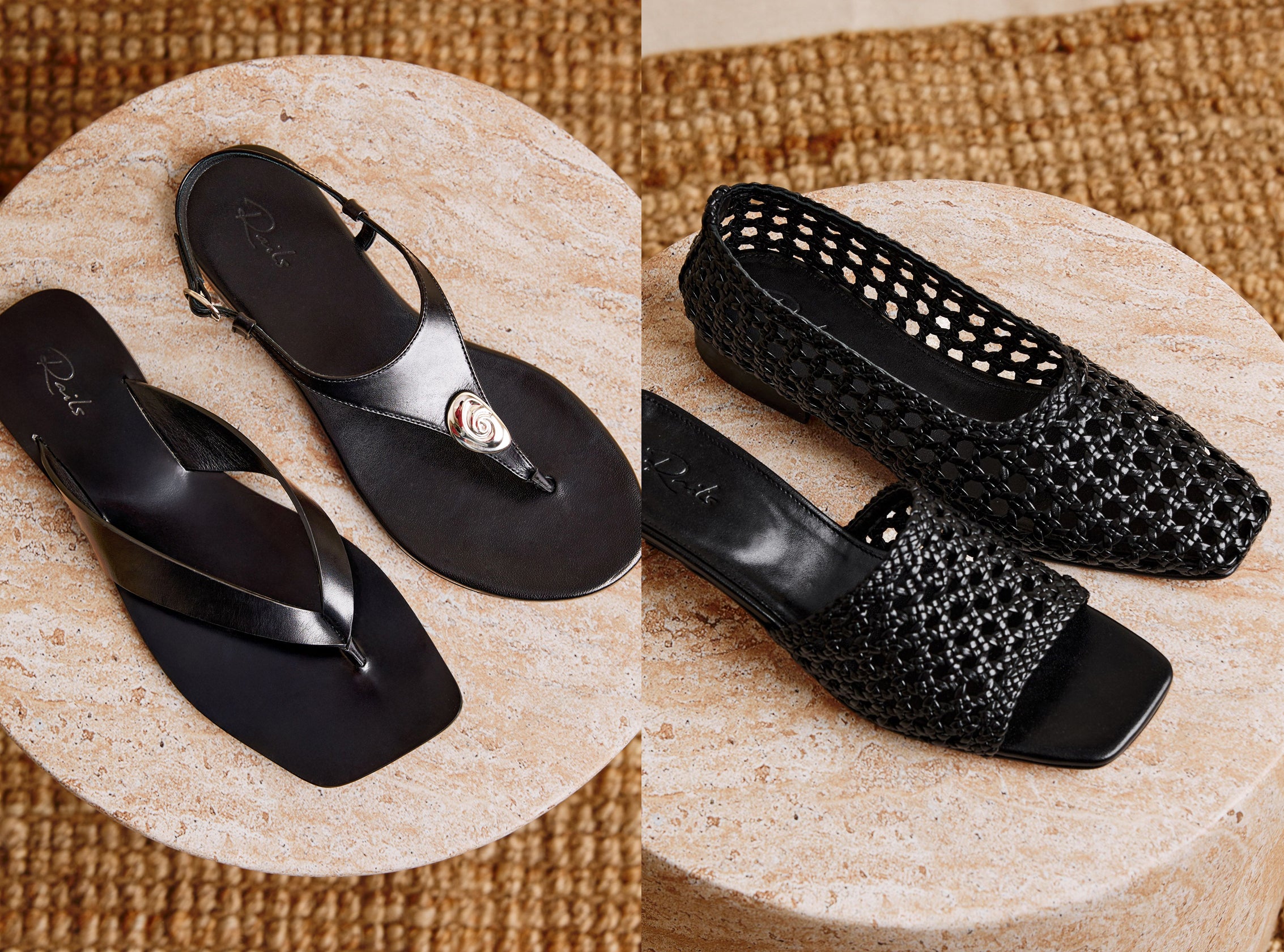 Black sandals with decorative elements on a textured surface