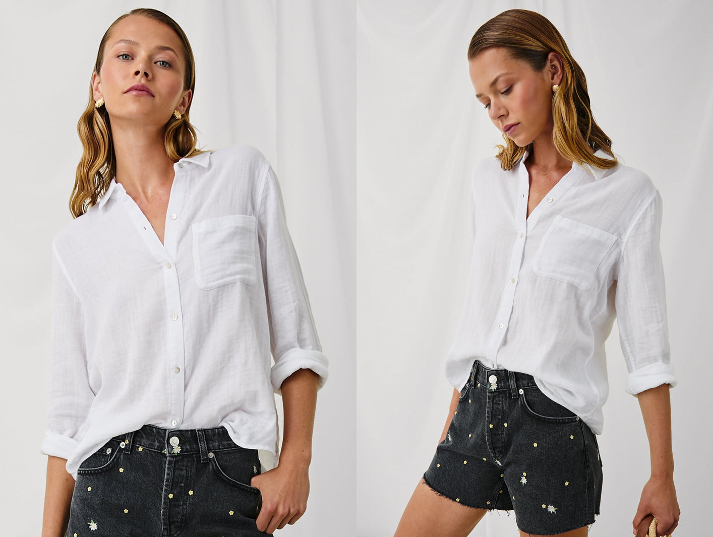 Woman wearing white button-up shirt and black shorts with flower patterns on a white background.