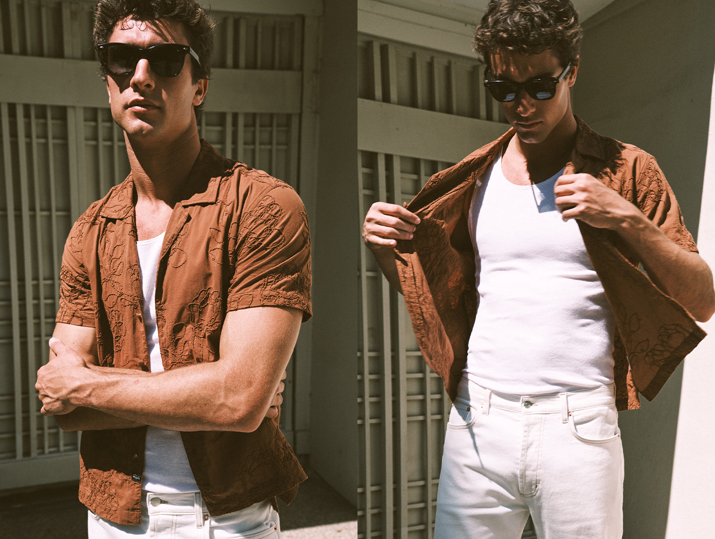 Man wearing a brown shirt over a white tank top and white pants, standing against a neutral background.