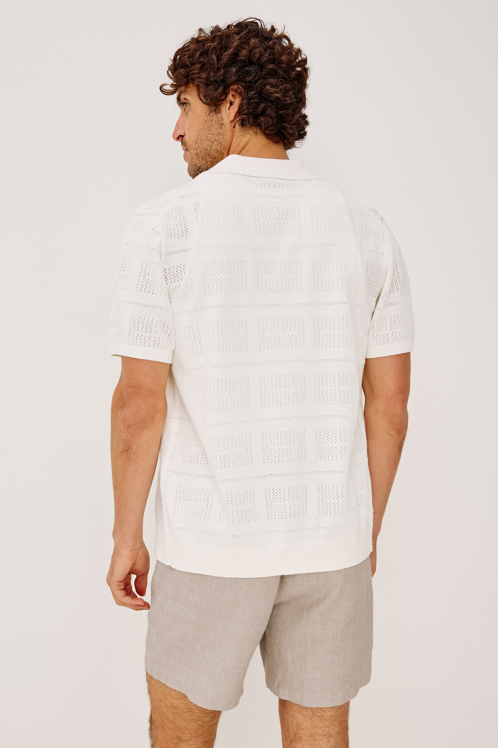 Yates Camp Shirt in Jacquard Knit With Open Collar, Short Sleeves, Front Buttons, and Relaxed Fit in White Colorway - Upper Body Back View Featured on Model