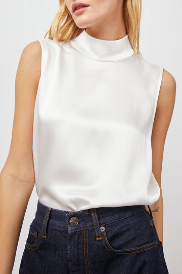 Yolie Sleeveless Tank Top with a Mock Neck and Two Button Back Neck Closure with a Keyhole in White Colorway - Front View Featured on Model