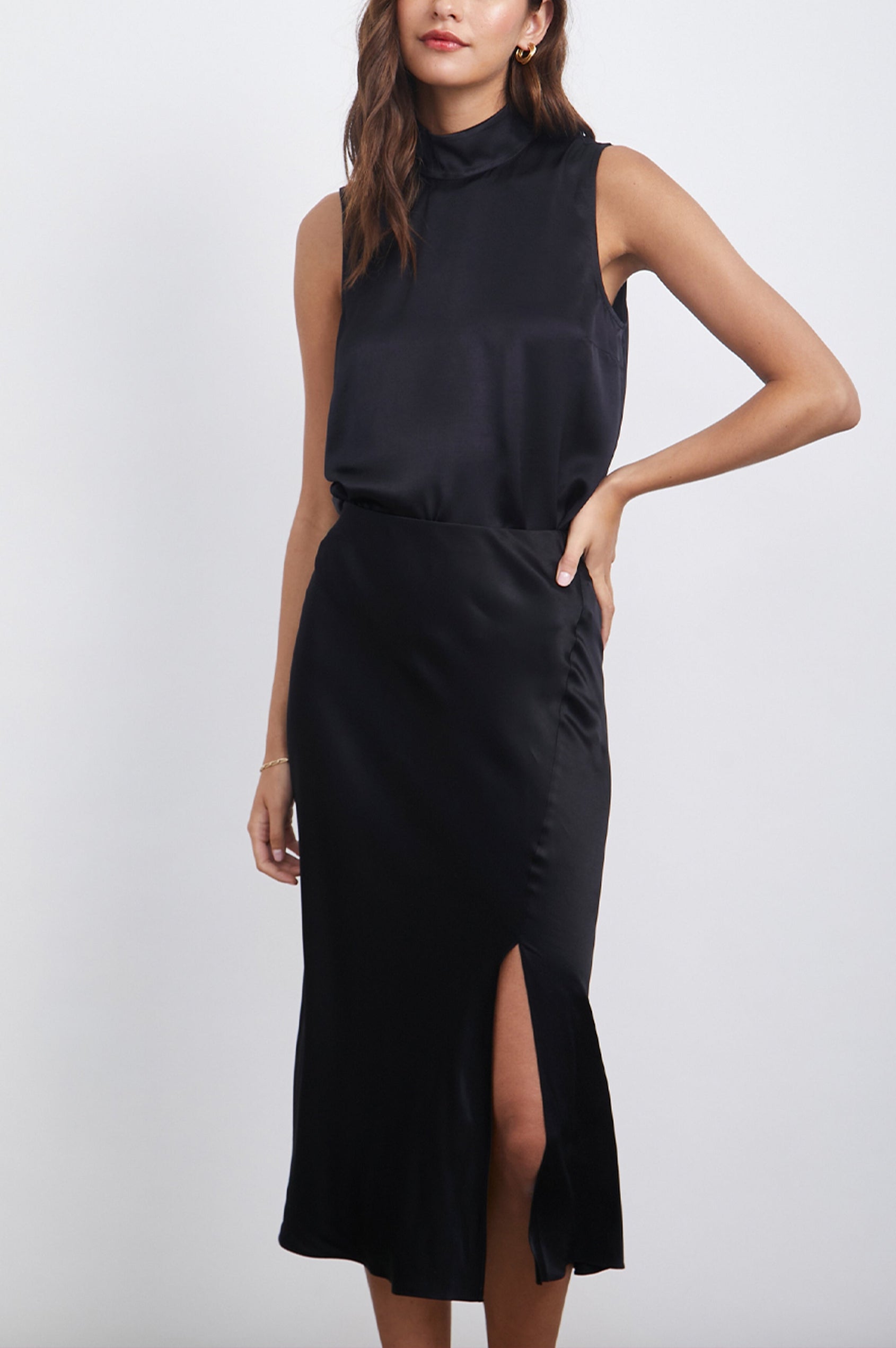 Yolie Sleeveless Tank Top with a Mock Neck and Two Button Back Neck Closure with a Keyhole in Black Colorway - Front View Featured on Model