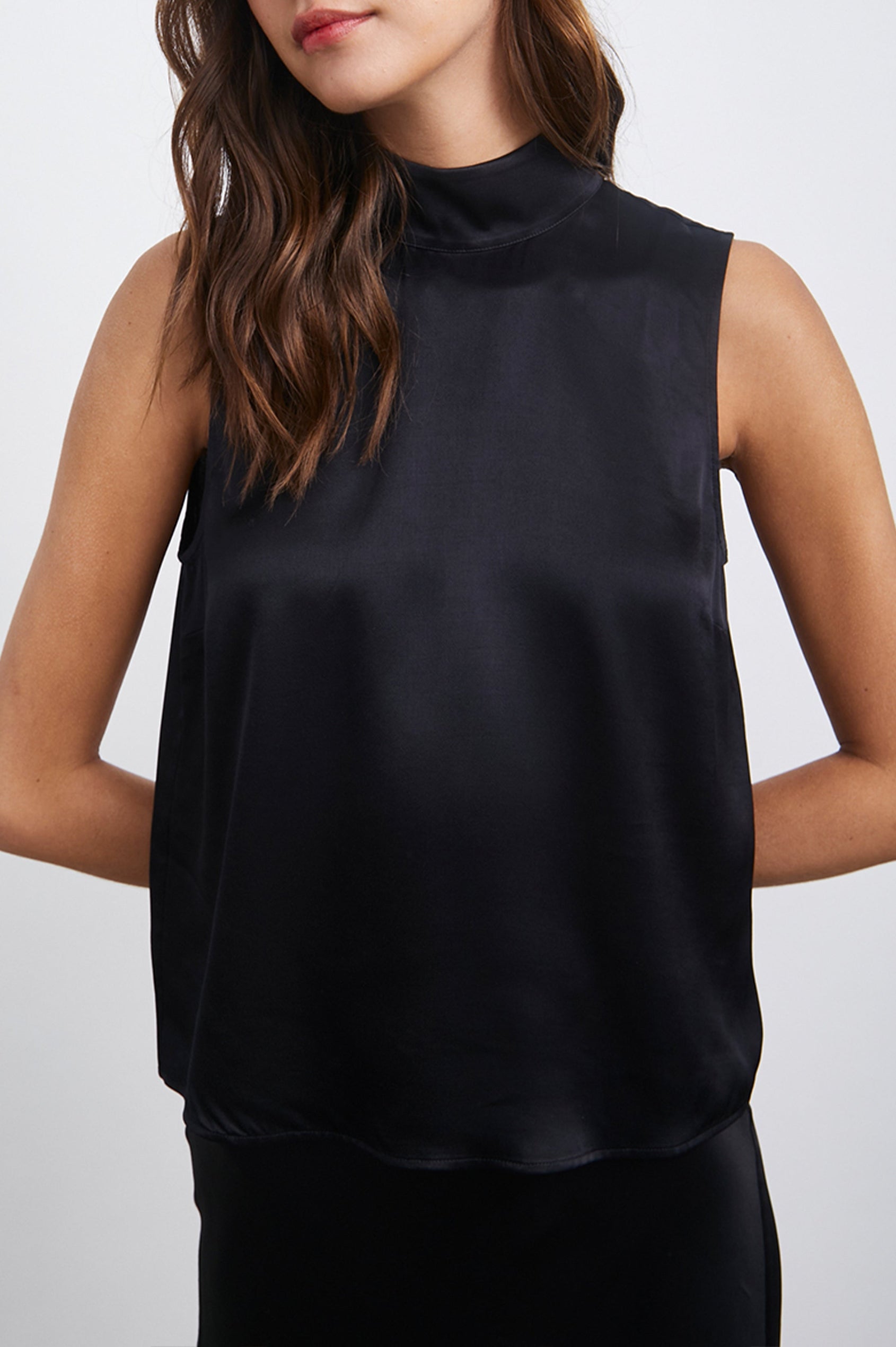 Yolie Sleeveless Tank Top with a Mock Neck and Two Button Back Neck Closure with a Keyhole in Black Colorway - Front View Featured on Model