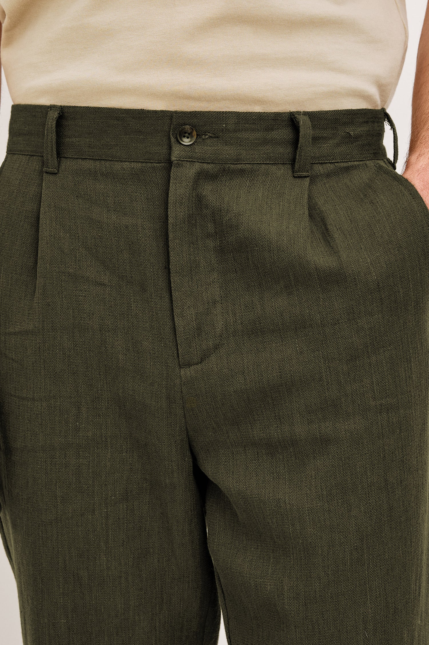 Zimmer Pant in Cotton Linen Wool Blend With Relaxed Fit, Tapered Leg, Side Pockets, Zip Fly, Belt Loops, and Back Welt Pockets in Deep Olive Colorway - Lower Body Front View Featured on Model