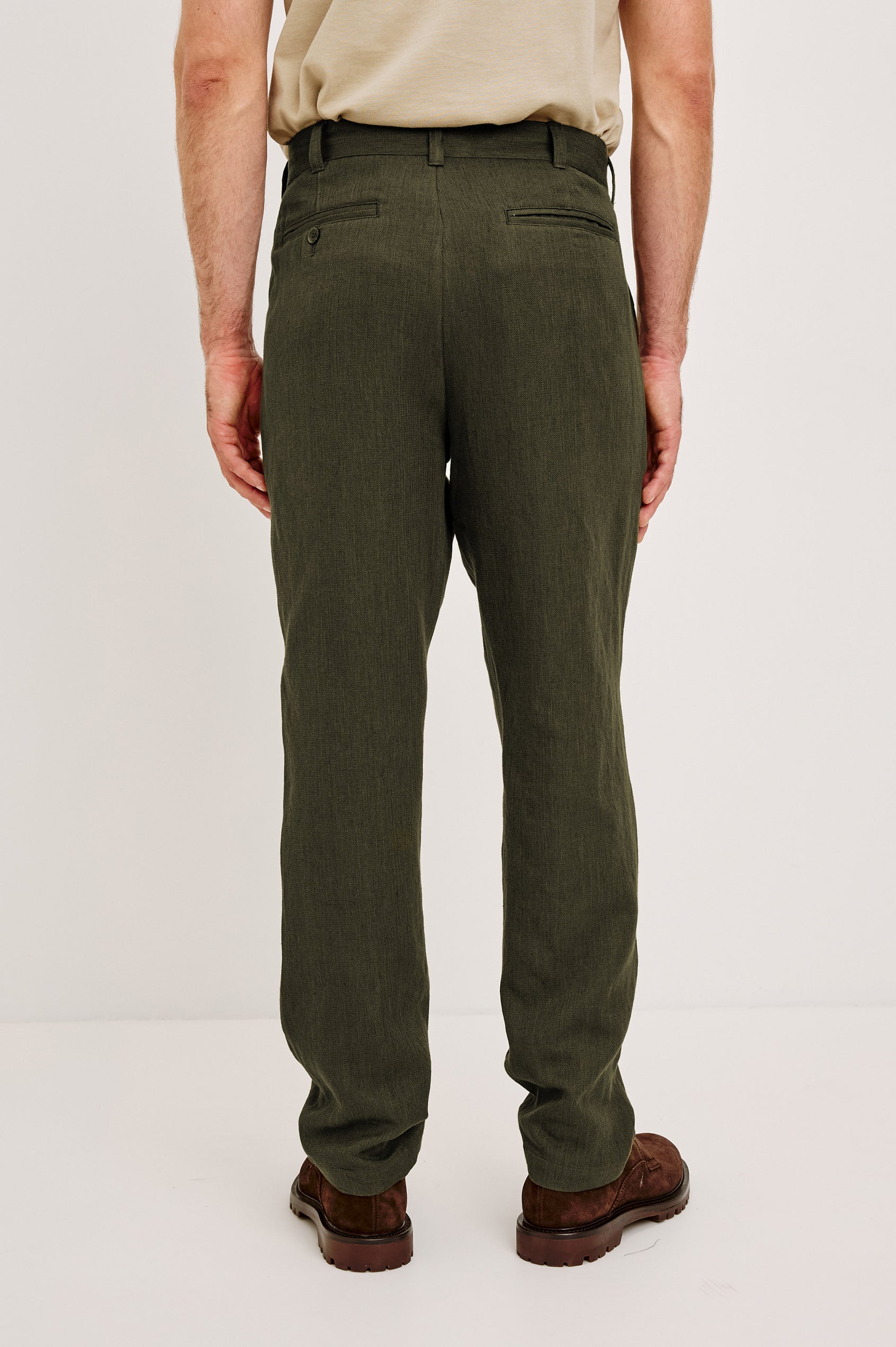 Zimmer Pant in Cotton Linen Wool Blend With Relaxed Fit, Tapered Leg, Side Pockets, Zip Fly, Belt Loops, and Back Welt Pockets in Deep Olive Colorway - Lower Body Front View Featured on Model