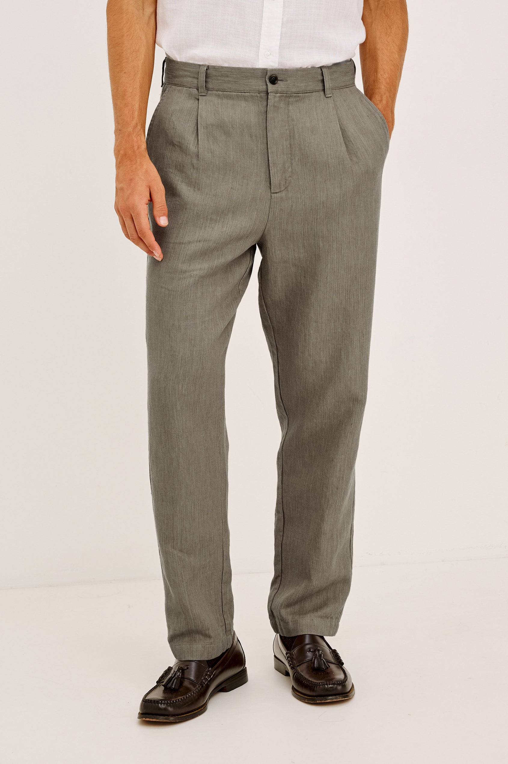 Zimmer Pant in Cotton Linen Wool Blend With Relaxed Fit, Tapered Leg, Side Pockets, Zip Fly, Belt Loops, and Back Welt Pockets in Deep Olive Colorway - Lower Body Front View Featured on Model