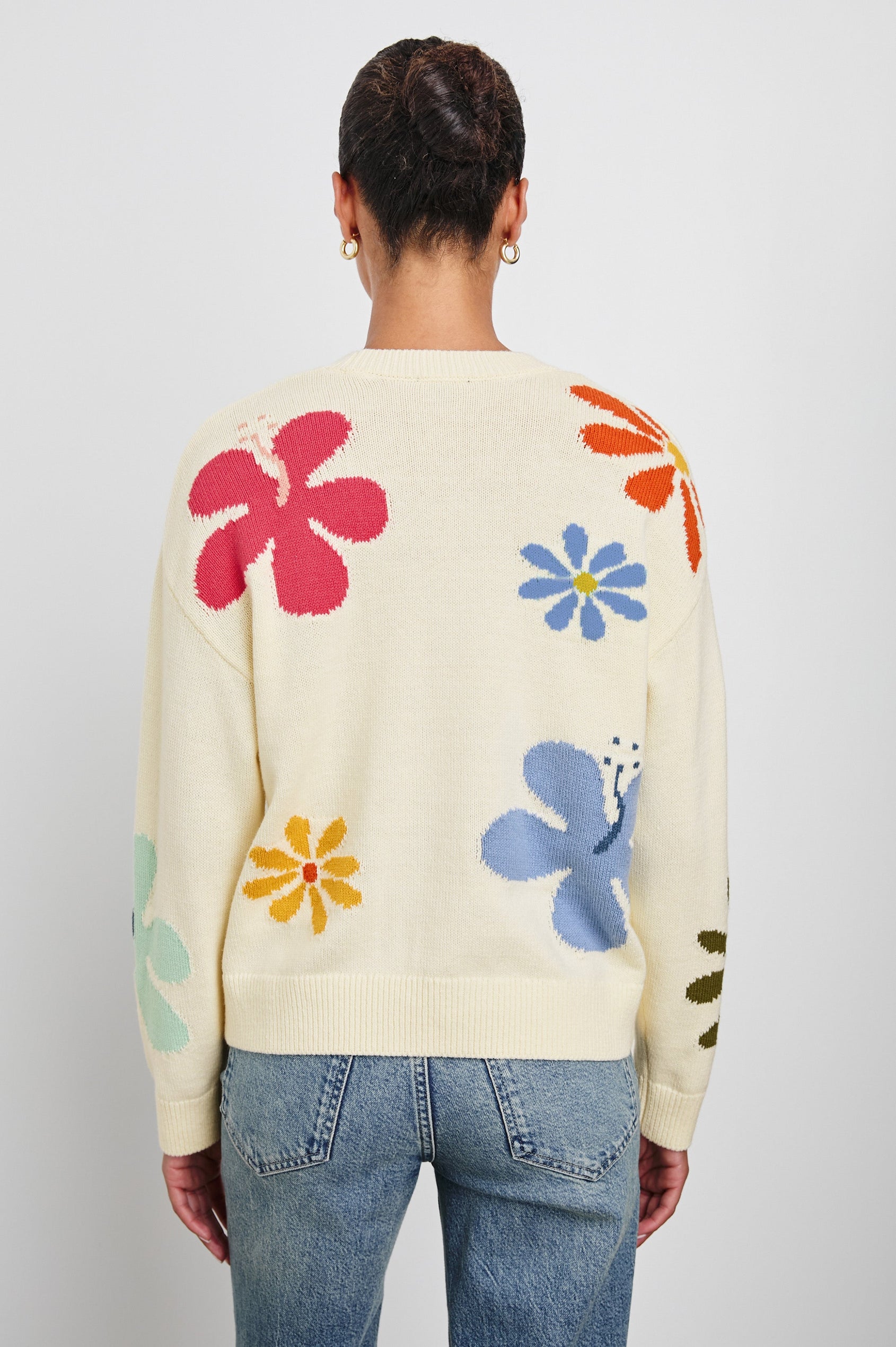 Zoey Long Sleeve Crew Neck Sweater With Multiple Colored Flowers In Colorway Ivory Hibiscus - Back View Featured On Model