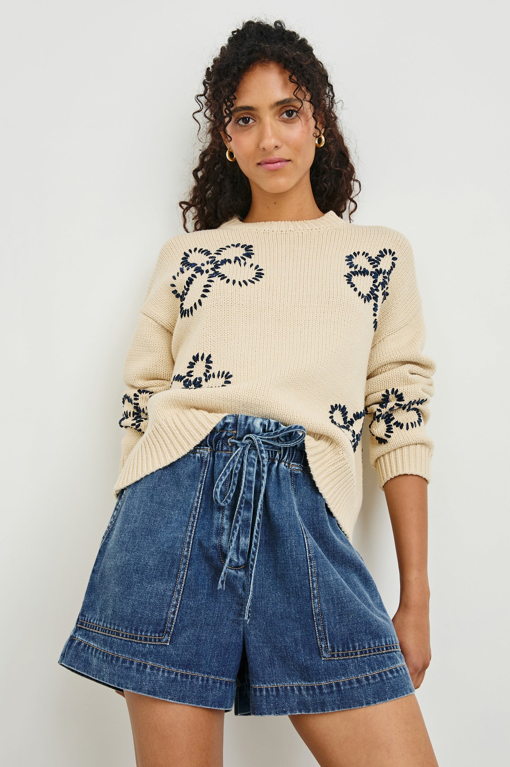 Zoey Long-Sleeve Sweater with Crewneck and Ribbed Trims in Ivory Navy Stitched Daisies Colorway, Navy Daisies on Ivory - Front View Featured on Model