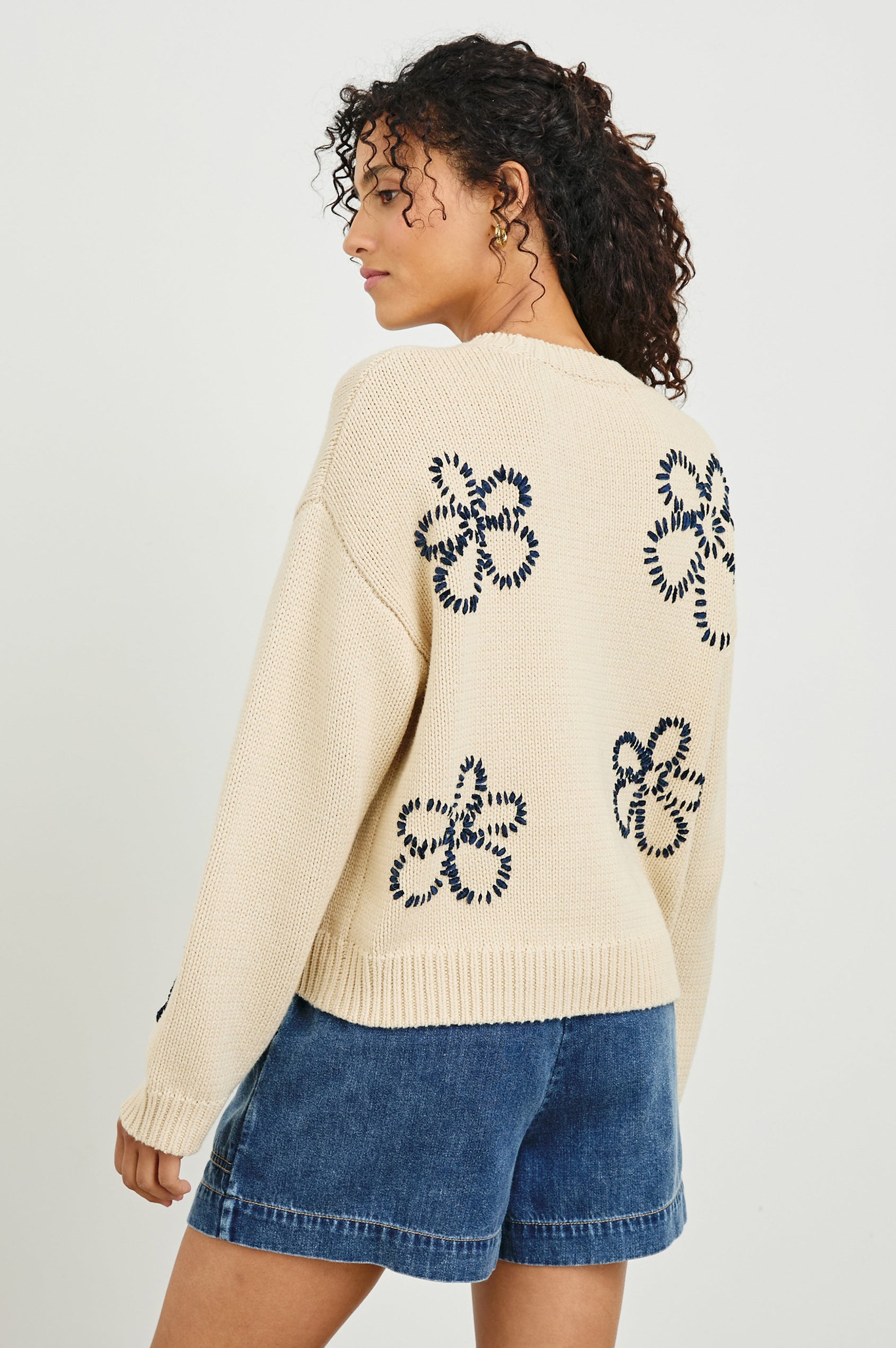 Zoey Long-Sleeve Sweater with Crewneck and Ribbed Trims in Ivory Navy Stitched Daisies Colorway, Navy Daisies on Ivory - Back View Featured on Model
