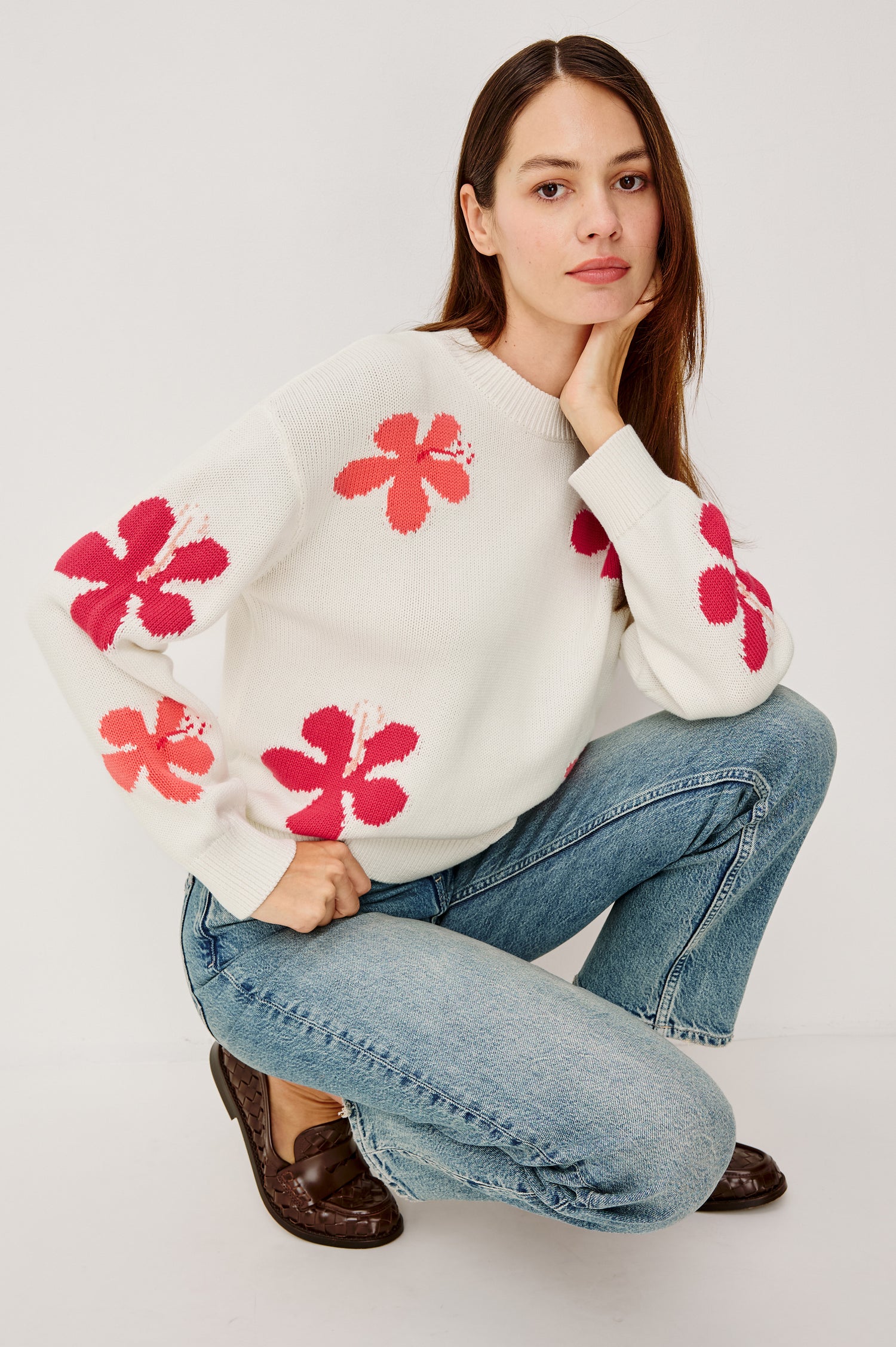Zoey Crewneck Sweater in Cotton Blend With Floral Motifs, Dropped Shoulders, and Long Sleeves in Kauai Colorway - Full Body View Featured on Model Sitting