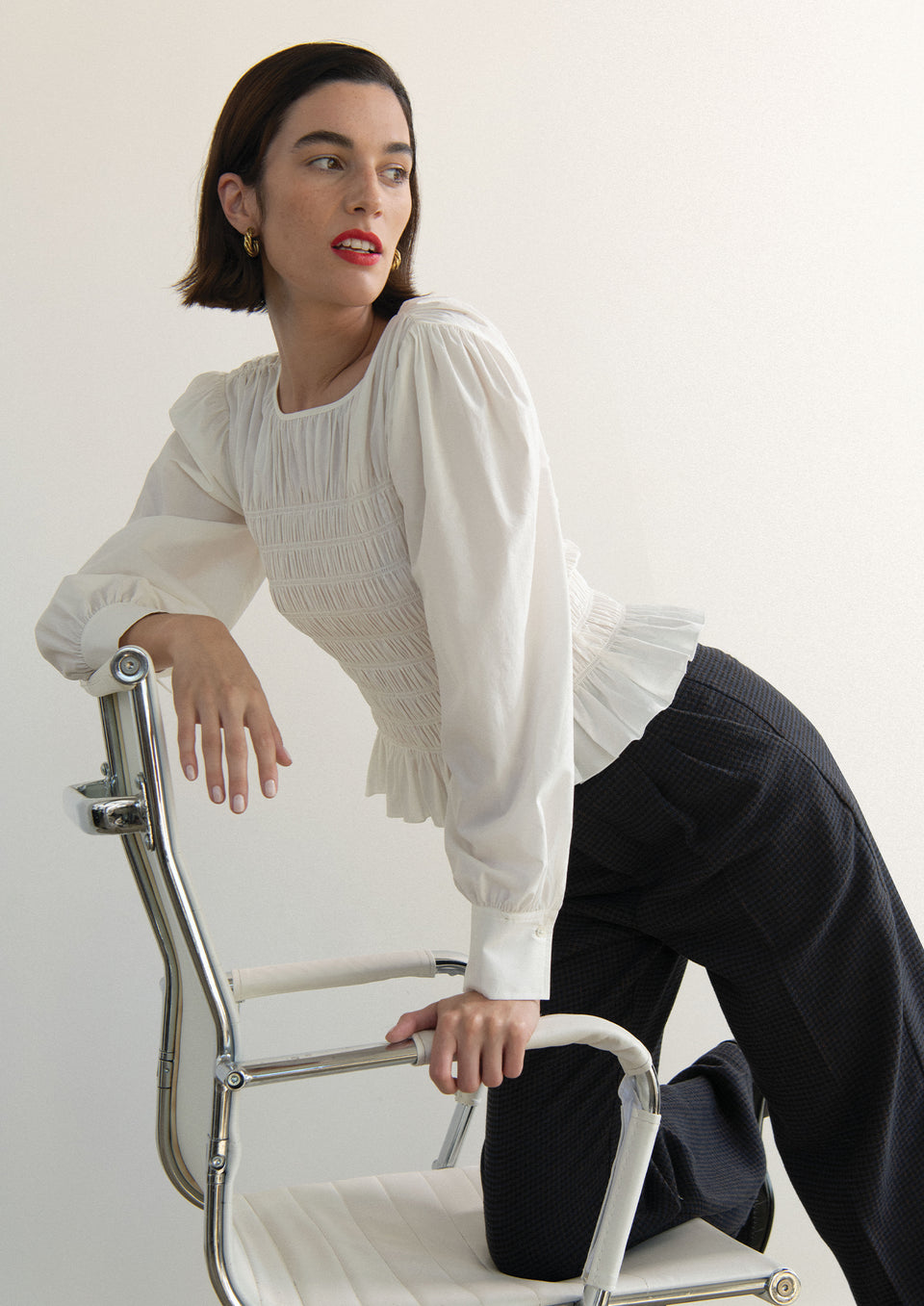 Side editorial image of model wearing Tabi Top and Marnie Pant