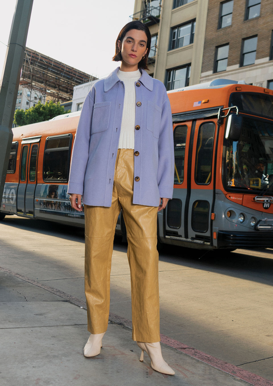 Front full body editorial image of model wearing Connie Shirt Jacket, Jo Pant, and Cher Sweater