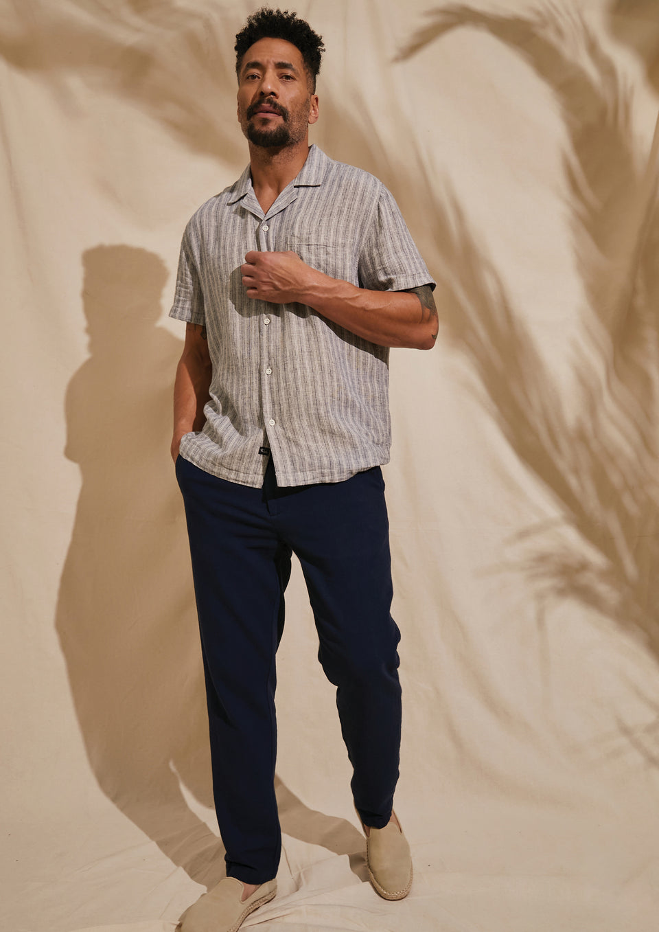 FRONT FULL BODY EDITORIAL IMAGE OF MODEL WEARING WAIMEA SHIRT AND CALLUM PANT