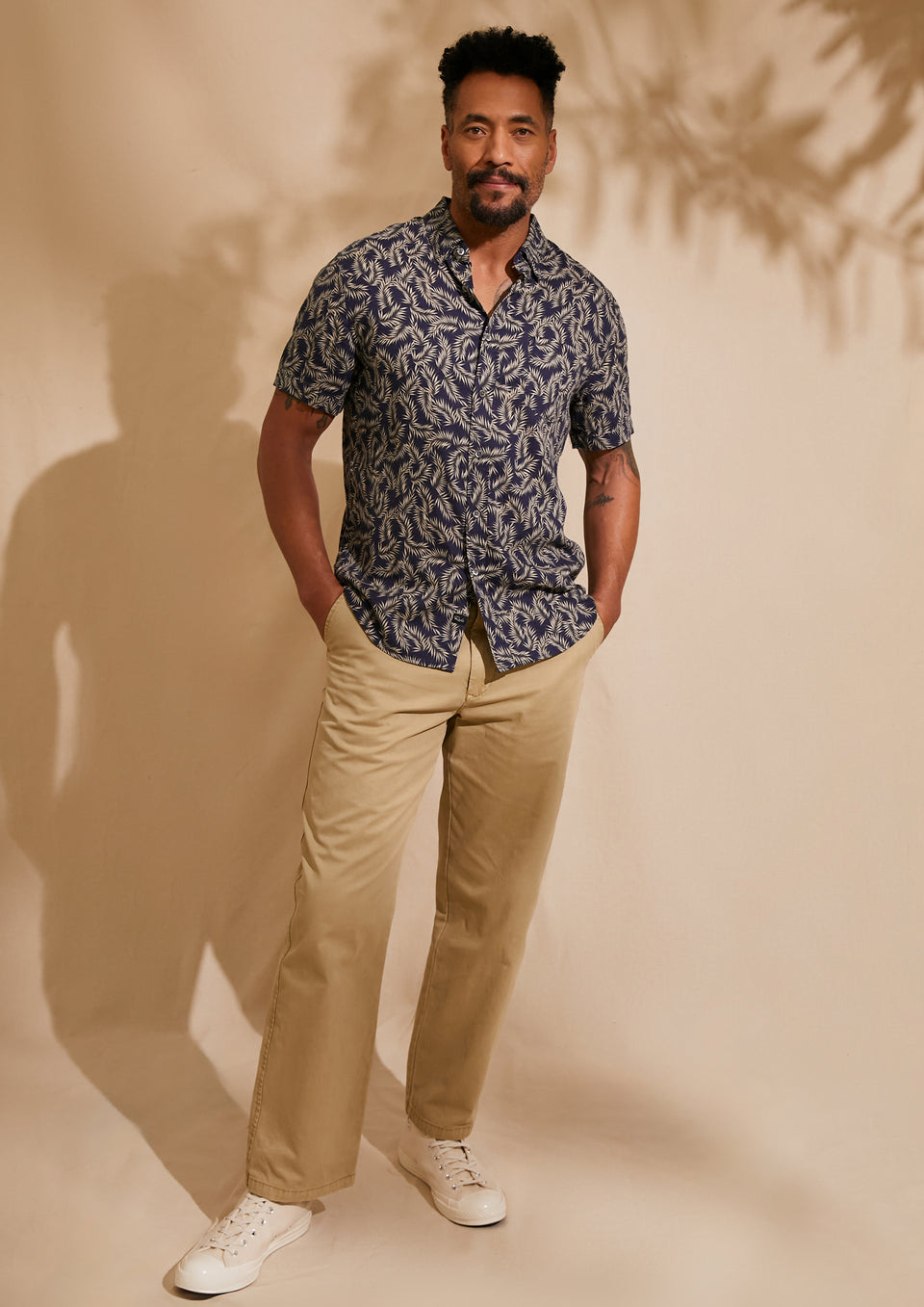 FRONT FULL BODY EDITORIAL IMAGE OF MODEL WEARING CARSON SHIRT AND GARRETT PANT