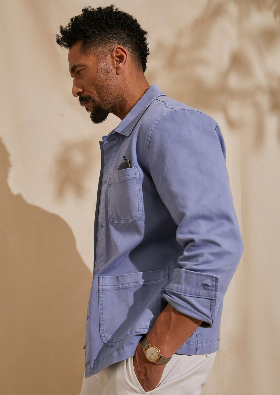 SIDE IMAGE OF MODEL WEARING LUC JACKET AND GARRETT PANT