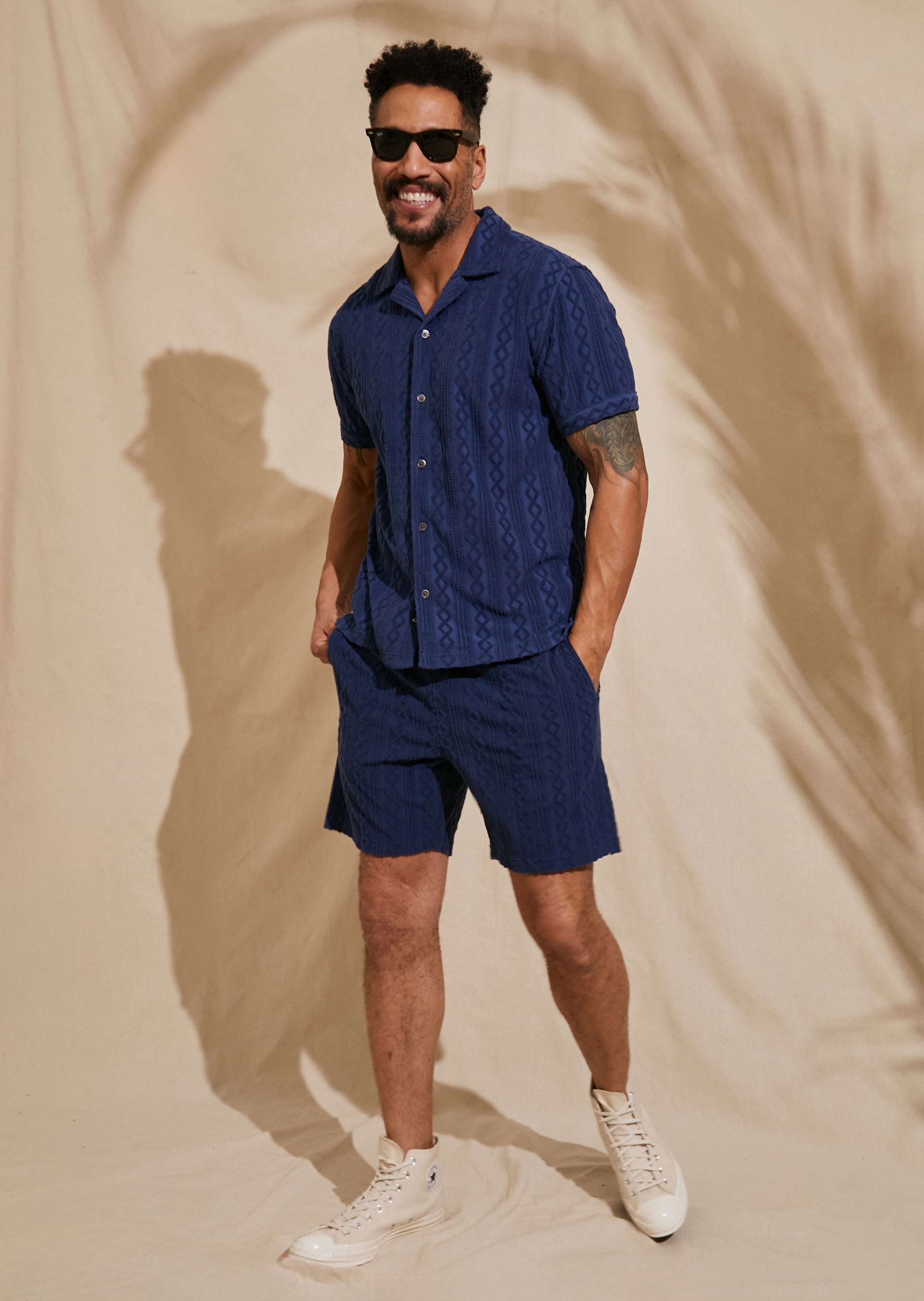 FRONT FULL BODY EDITORIAL IMAGE OF MODEL WEARING MAVERICK SHIRT AND NOVA SHORT