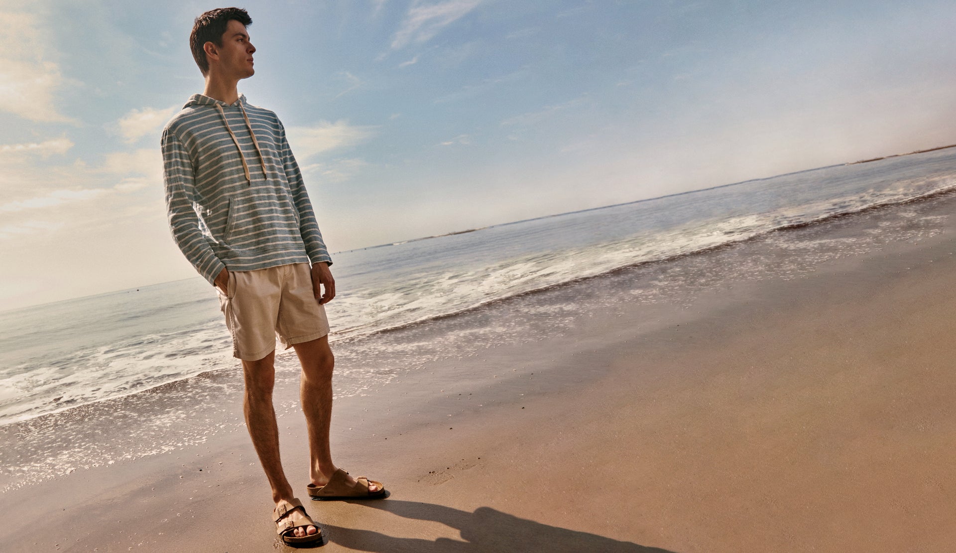 Full body editorial image of model wearing Mammoth Hoodie and Cruz Short