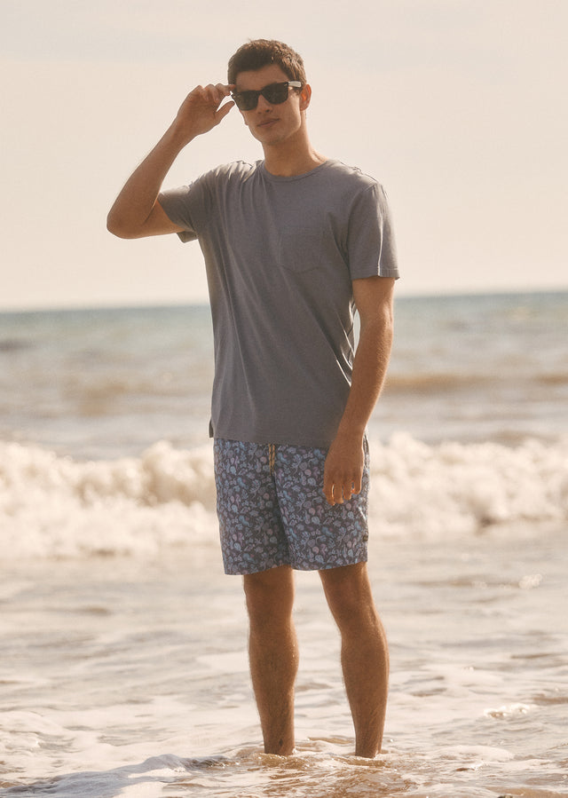 Full body editorial image of model wearing Johnny T-shirt and Kian Swim Short
